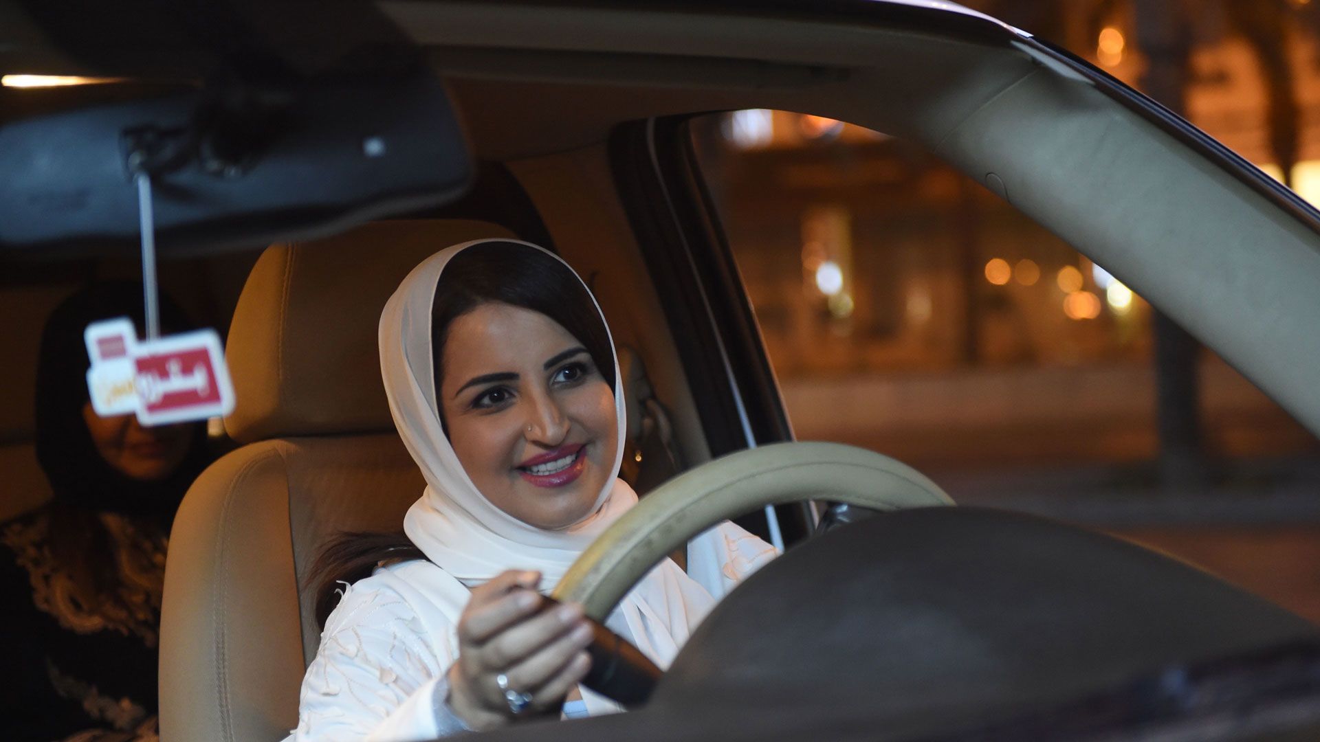 A Saudi woman drives her car through the streets of the Saudi capital Riyadh for the first time just after midnight, June 24, 2018, when the law allowing women to drive took effect