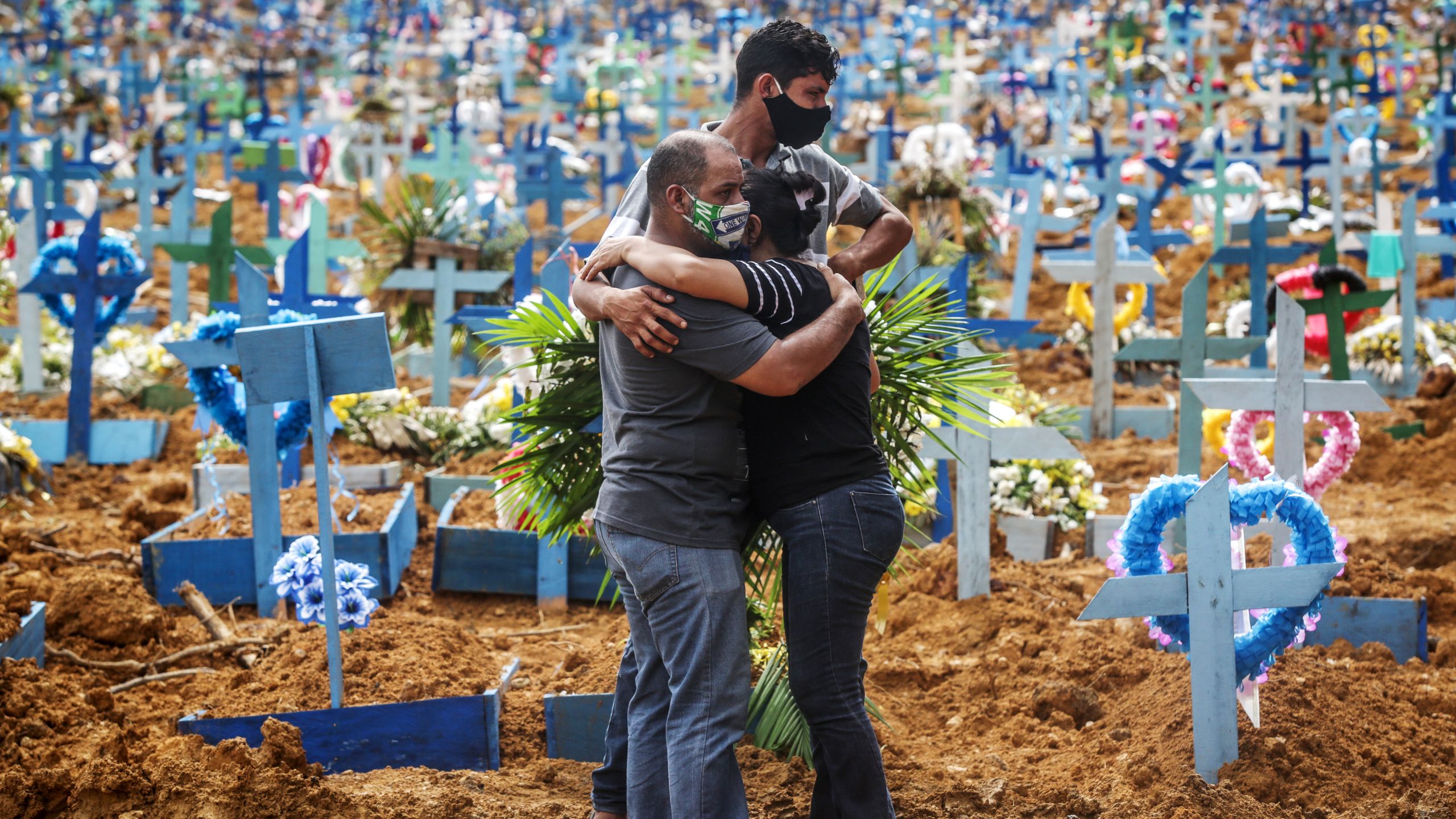 Families mourn at a mass funeral for victims of covid-19, Manaus, Brazil
