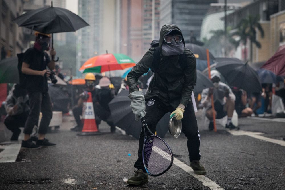 Protester hold tennis racket