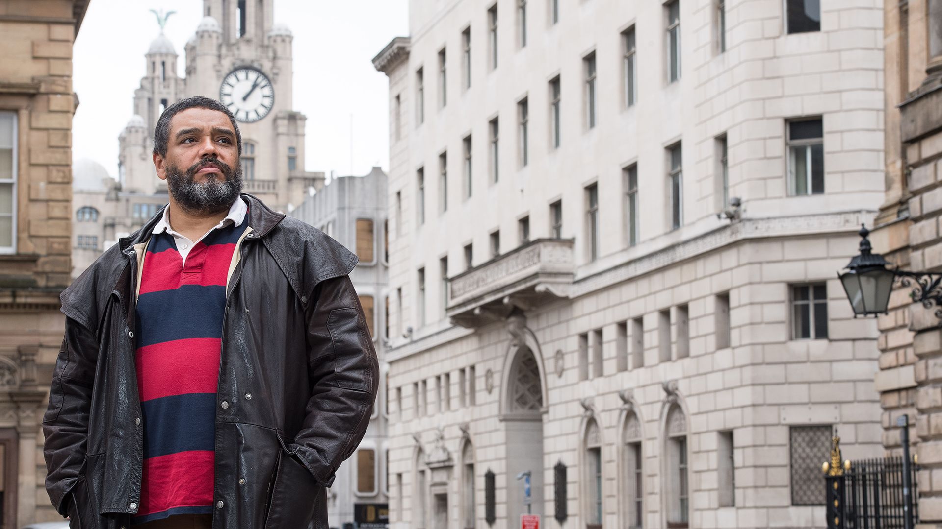 Malik outside Martins Building in Liverpool