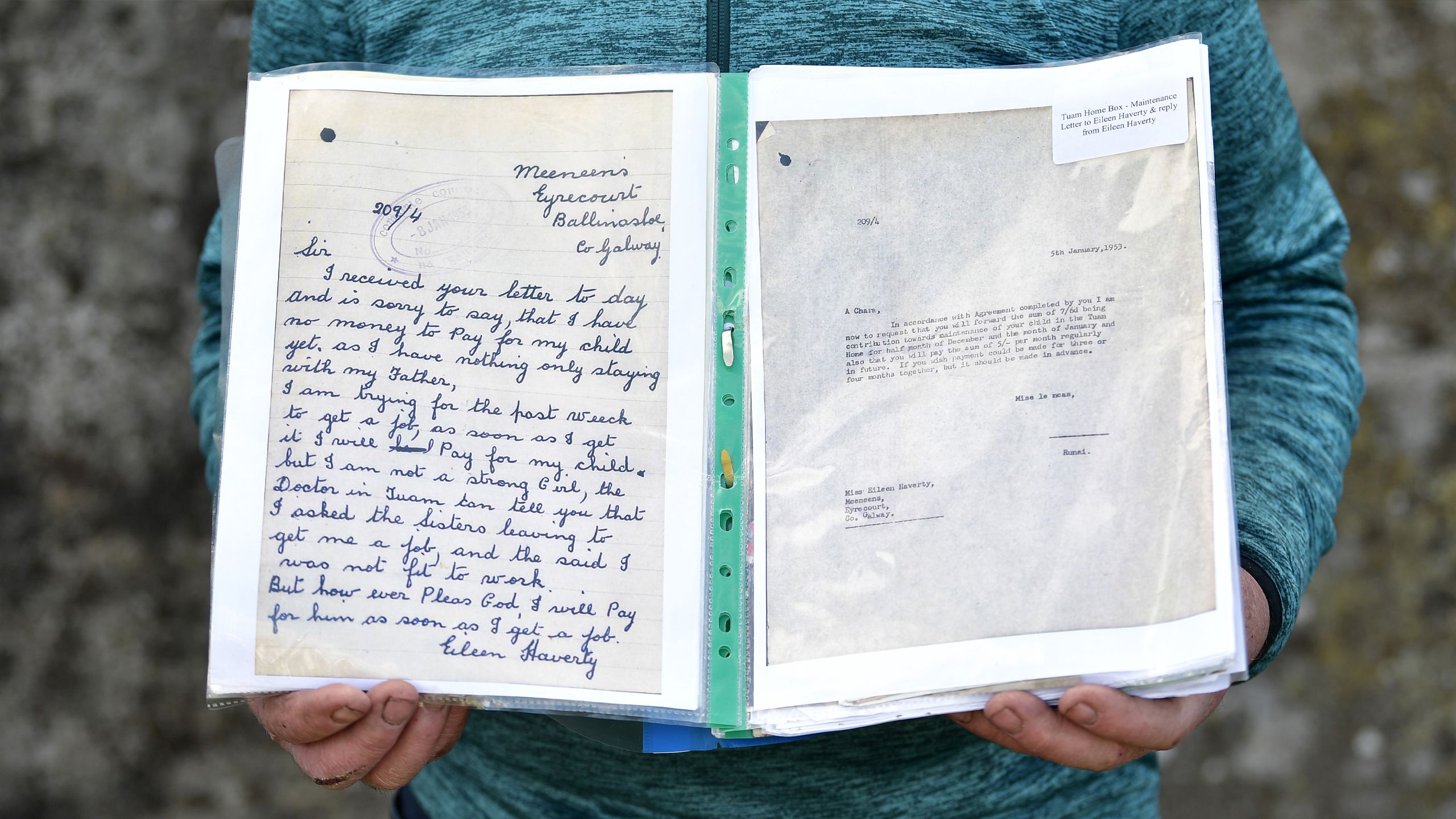 PJ Haverty holding a folder displaying two letters. On the left is letter from Eileen Haverty saying that she has no money to pay for her child and that she will pay as soon as possible. On the right is a letter from the home to Eileen asking for payment for her child.