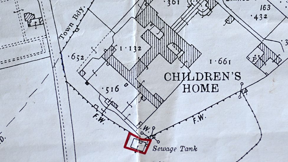 A plan of the site showing the location of a sewage tank