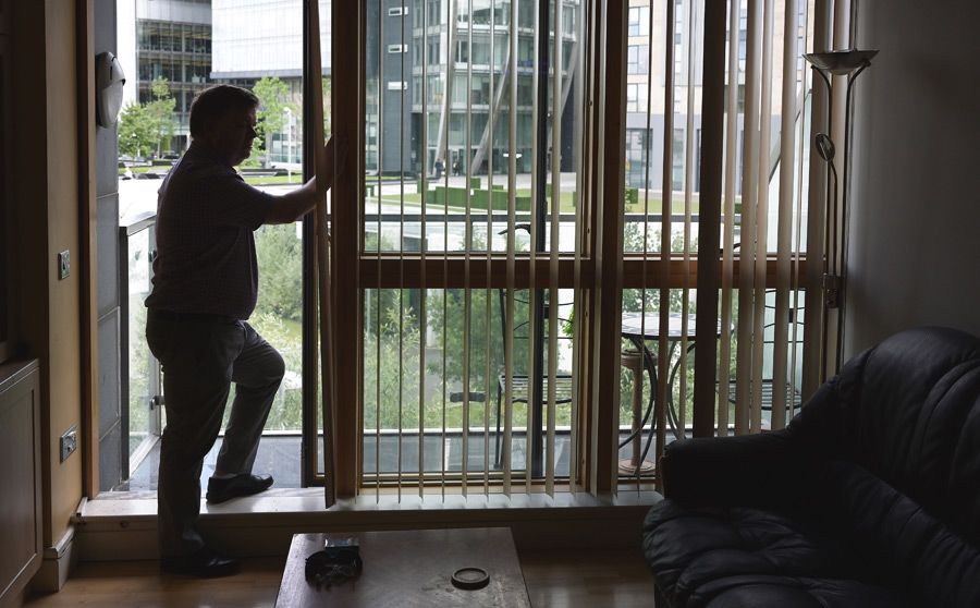 William standing in his apartment in Dublin