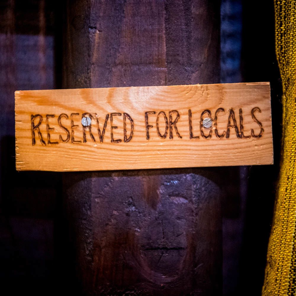 Sign: "Reserved for locals"