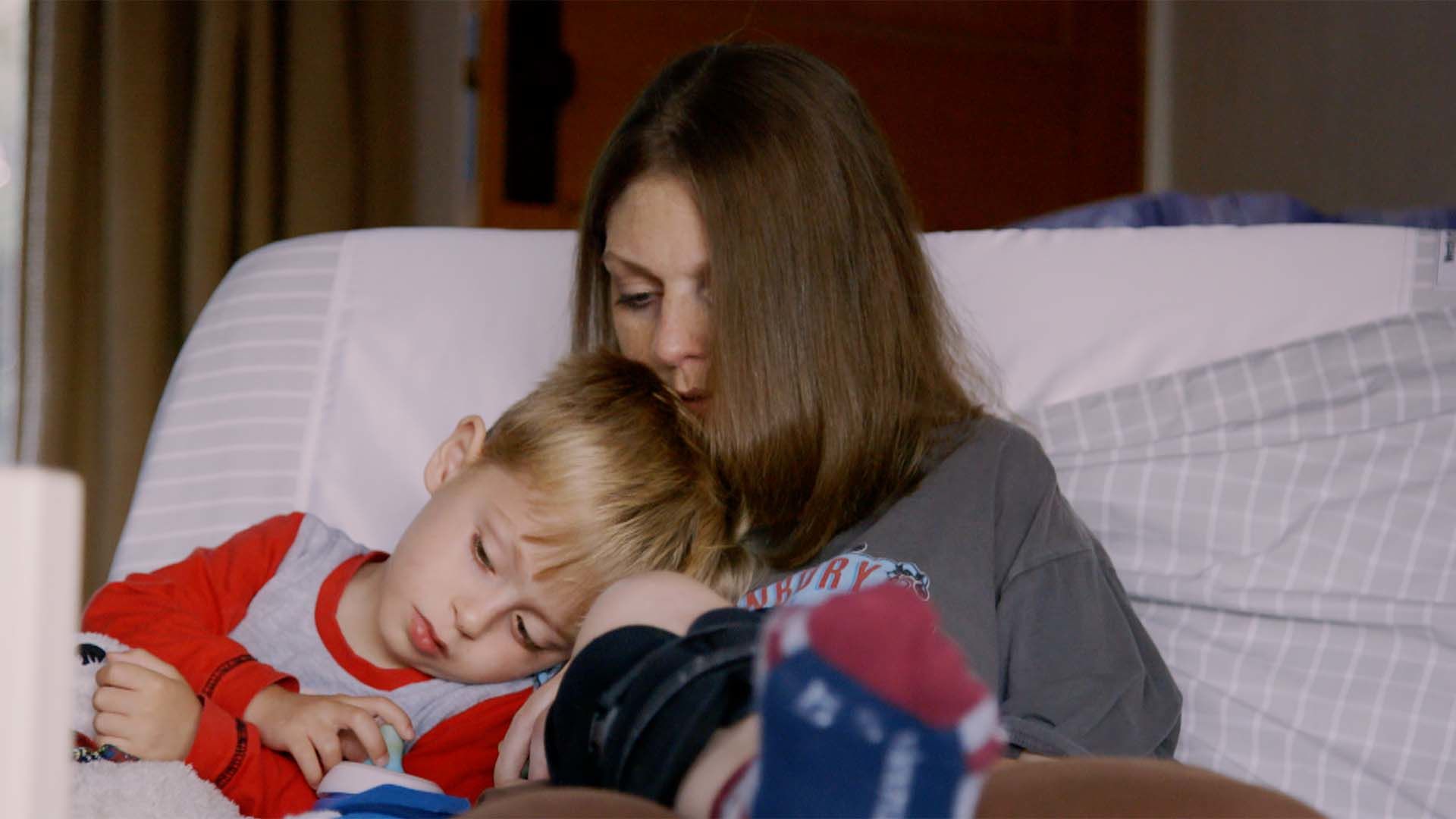 Martine cuddling one of her boys