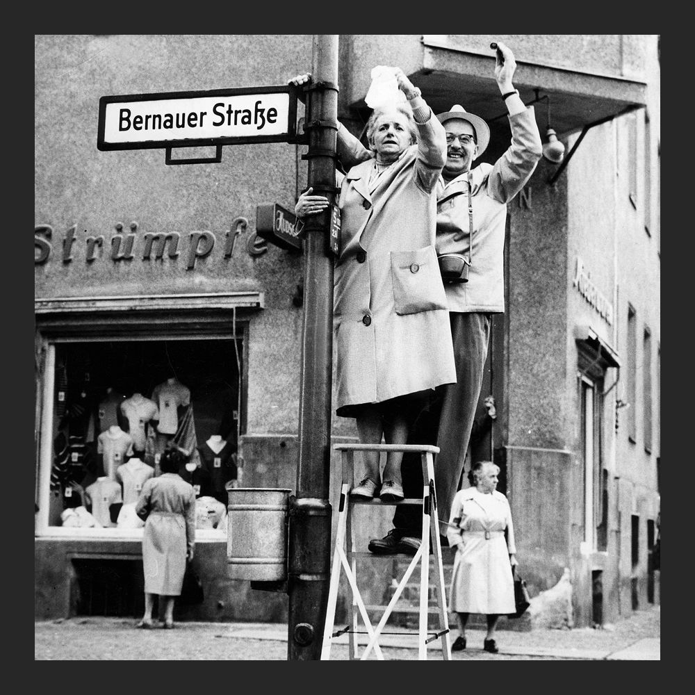 West Berlin citizens waving to East Berlin on Bernauer Strasse, 1961.