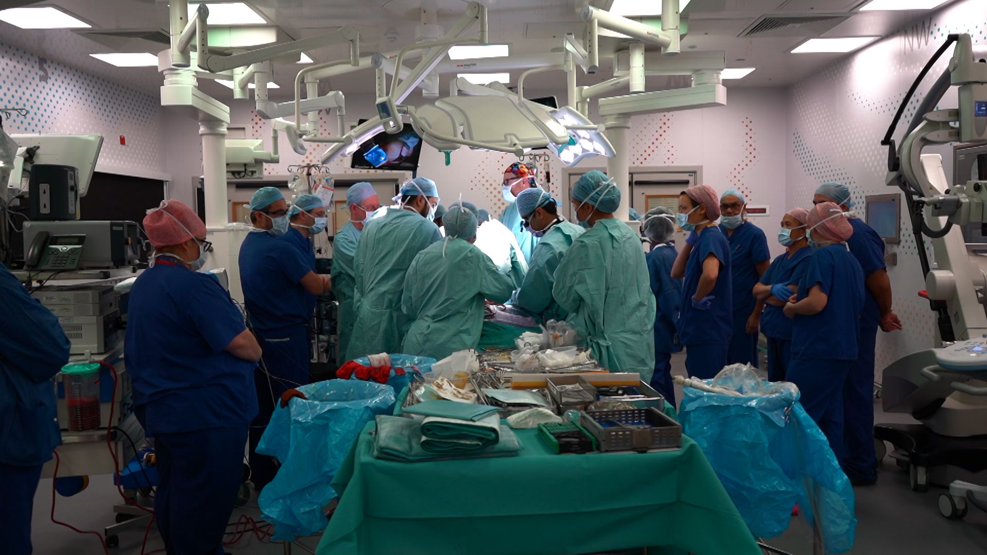 Surgery team operating to separate the twins