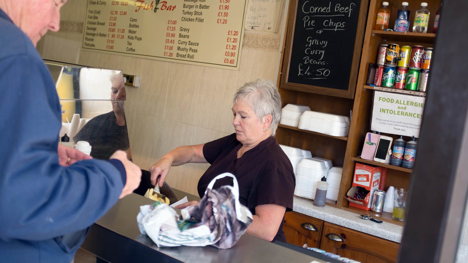 Norma Seldon serving a customer