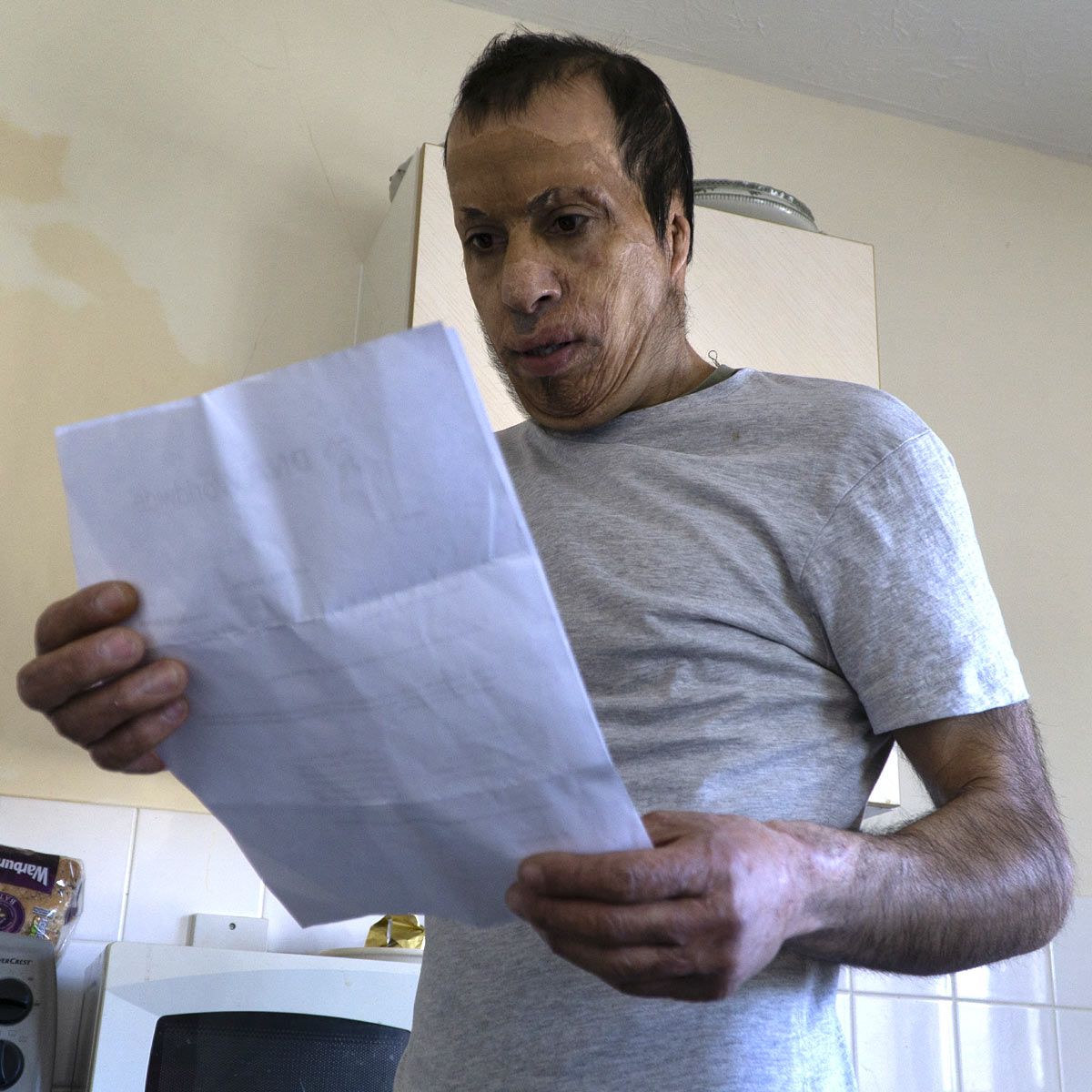 Amar looking at document