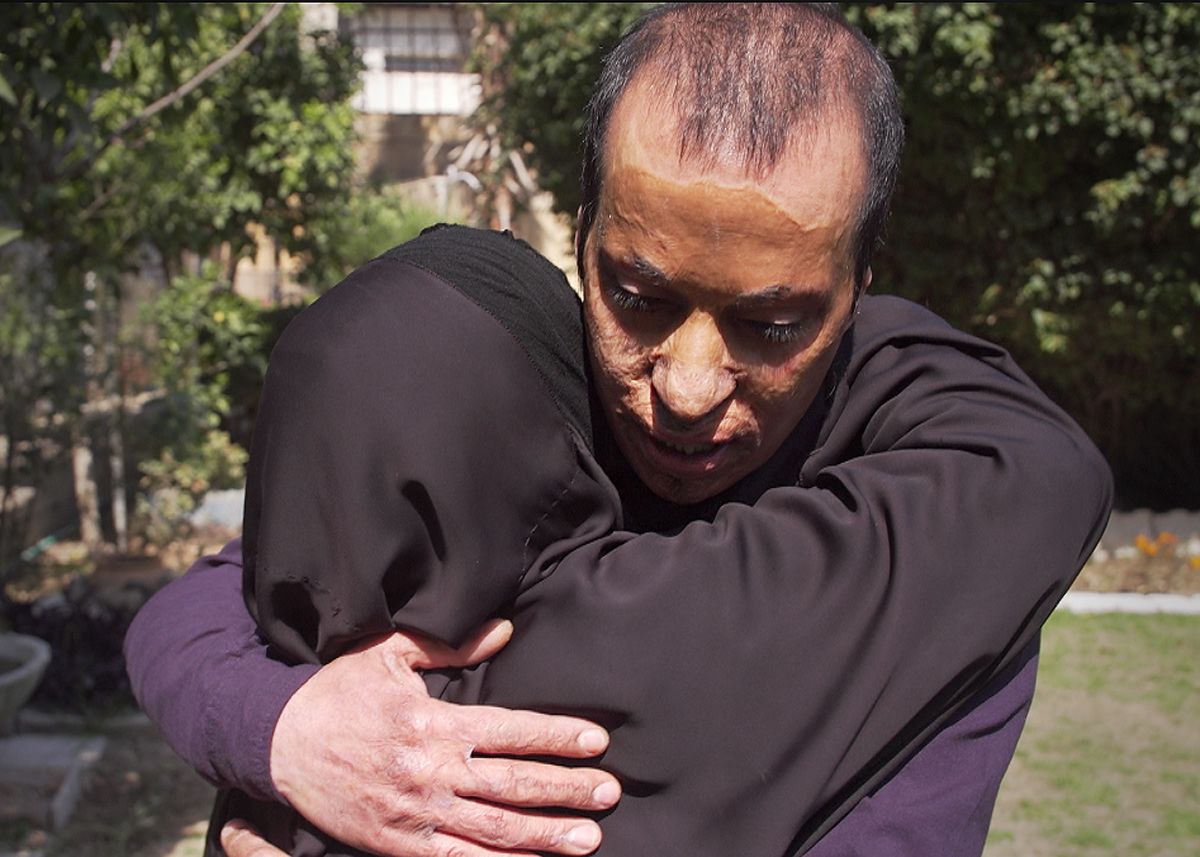 Amar hugs his mother