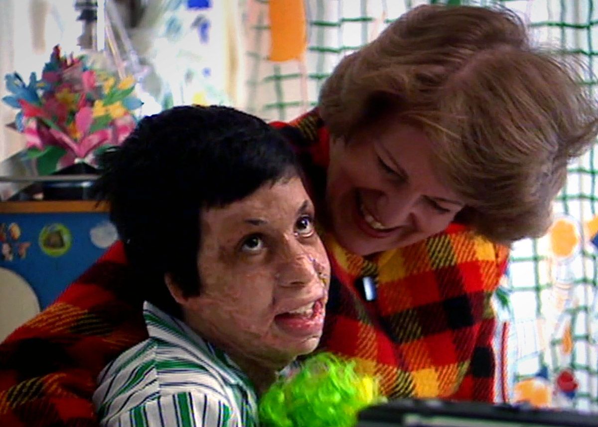 Amar as a boy with Emma Nicholson