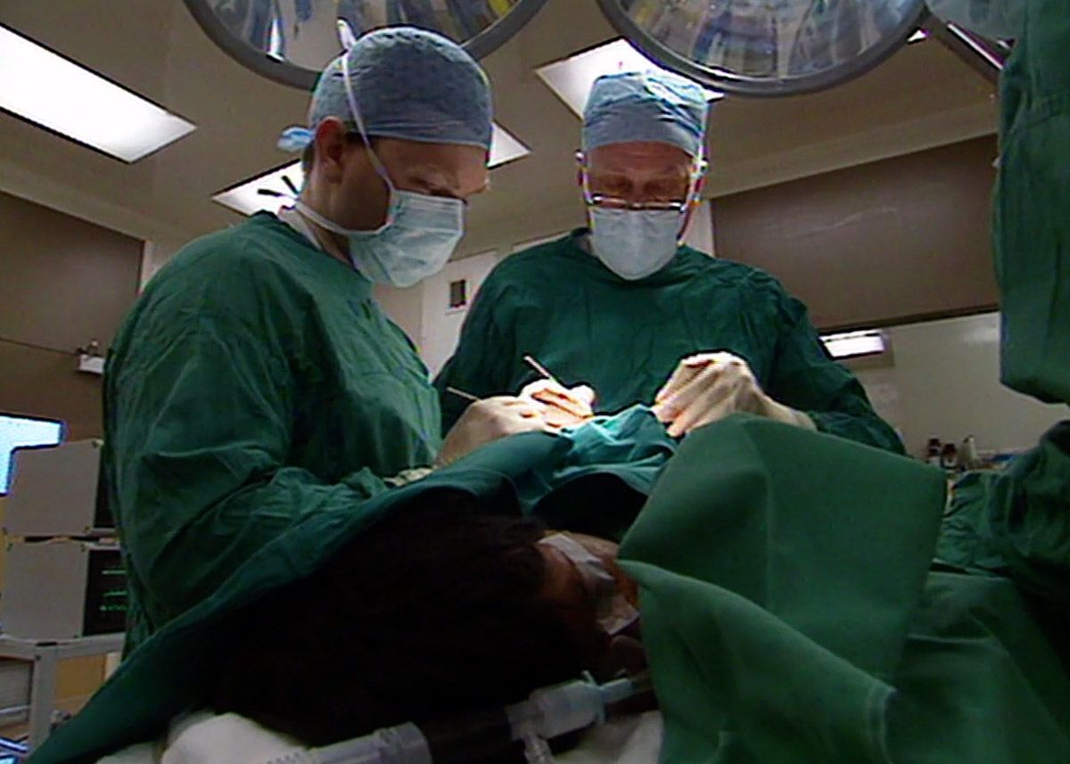Footage of surgeons operating on Amar