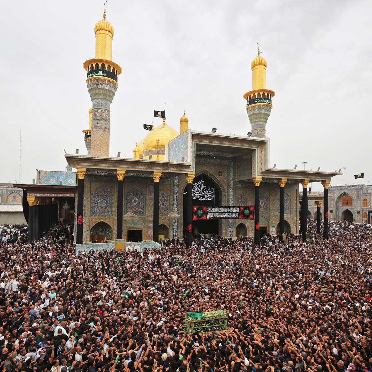 Shiite Muslim worshippers carry a symbolic casket as they gather at the Imam Moussa al-Kadhim's mosque in the Iraqi capital's northern district of Kadhimiya to mark the anniversary of the imam's death in the 8th Century.