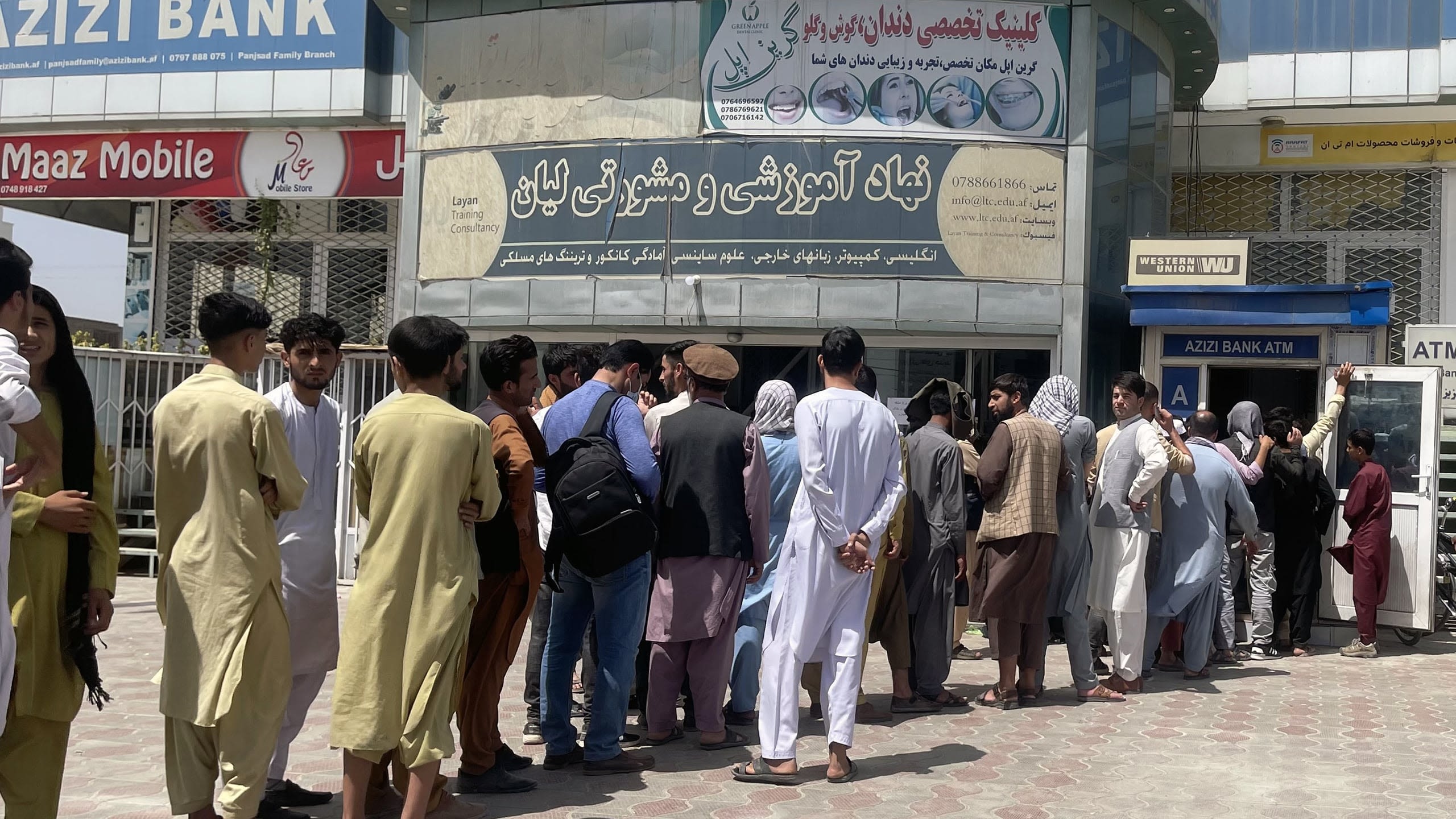 Customers start lining up outside banks to take out cash
