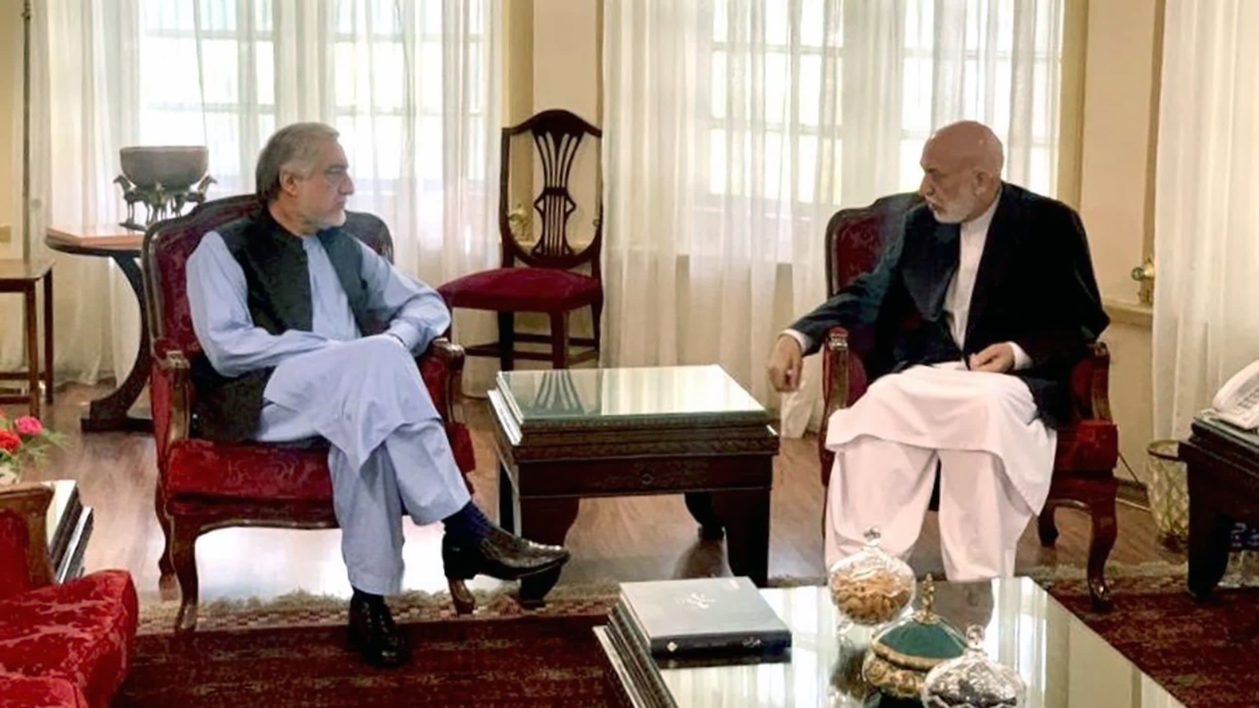Ex-President Hamid Karzai and Abdullah Abdullah, the Chairman of the National Reconciliation Council discuss last minute diplomacy