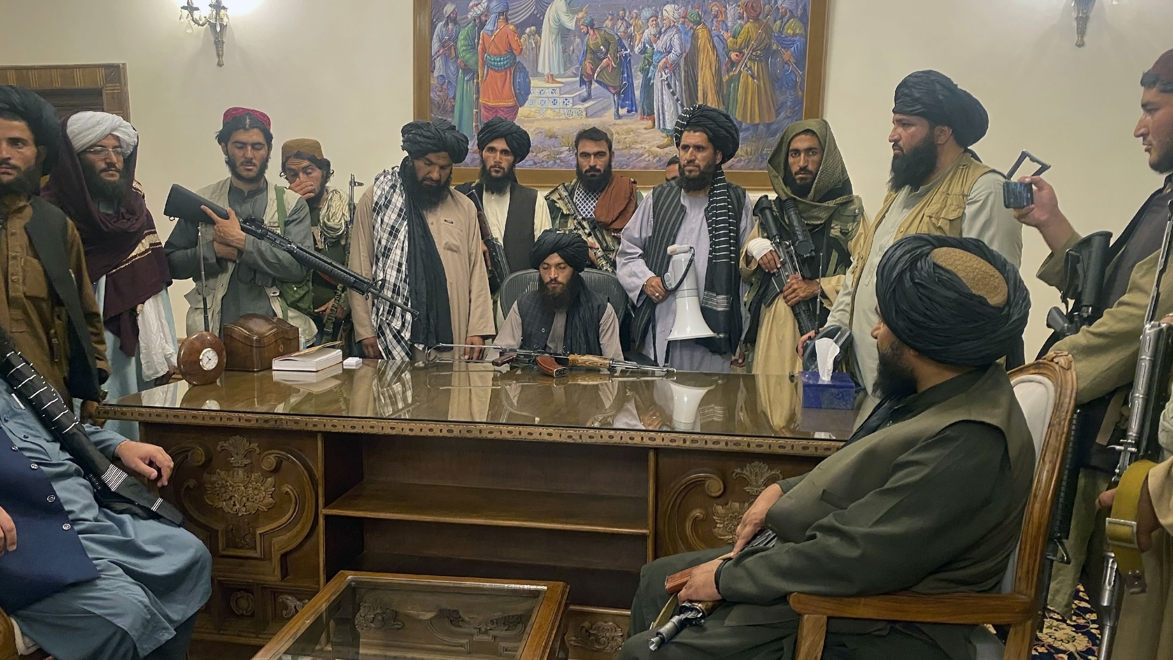Taliban pictured inside the Presidential Palace, late on August 15