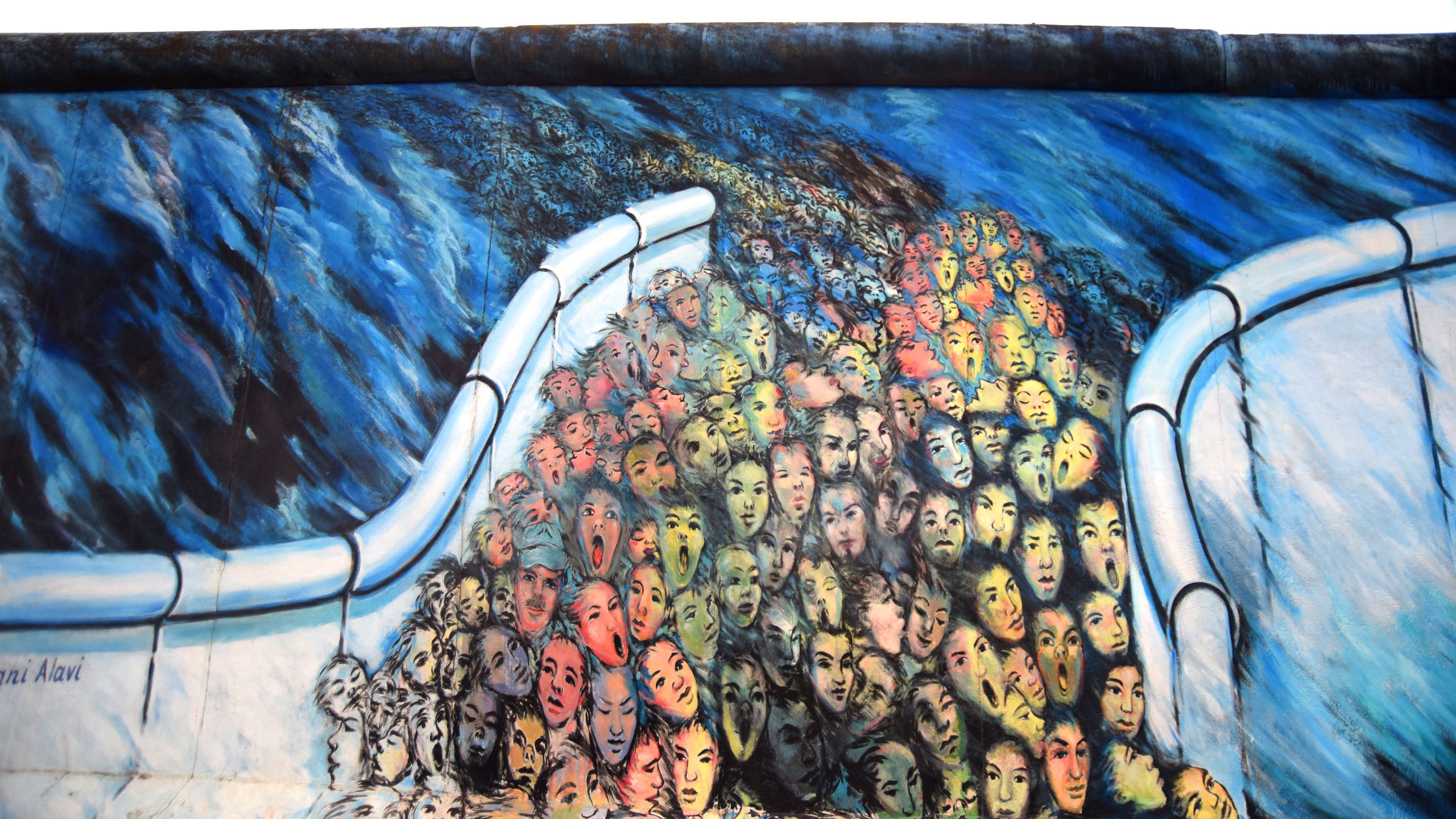 Mural ‘It Happened in November’ by Kani Alavi on the East Side Gallery, the longest preserved stretch of the wall in Berlin, Germany.