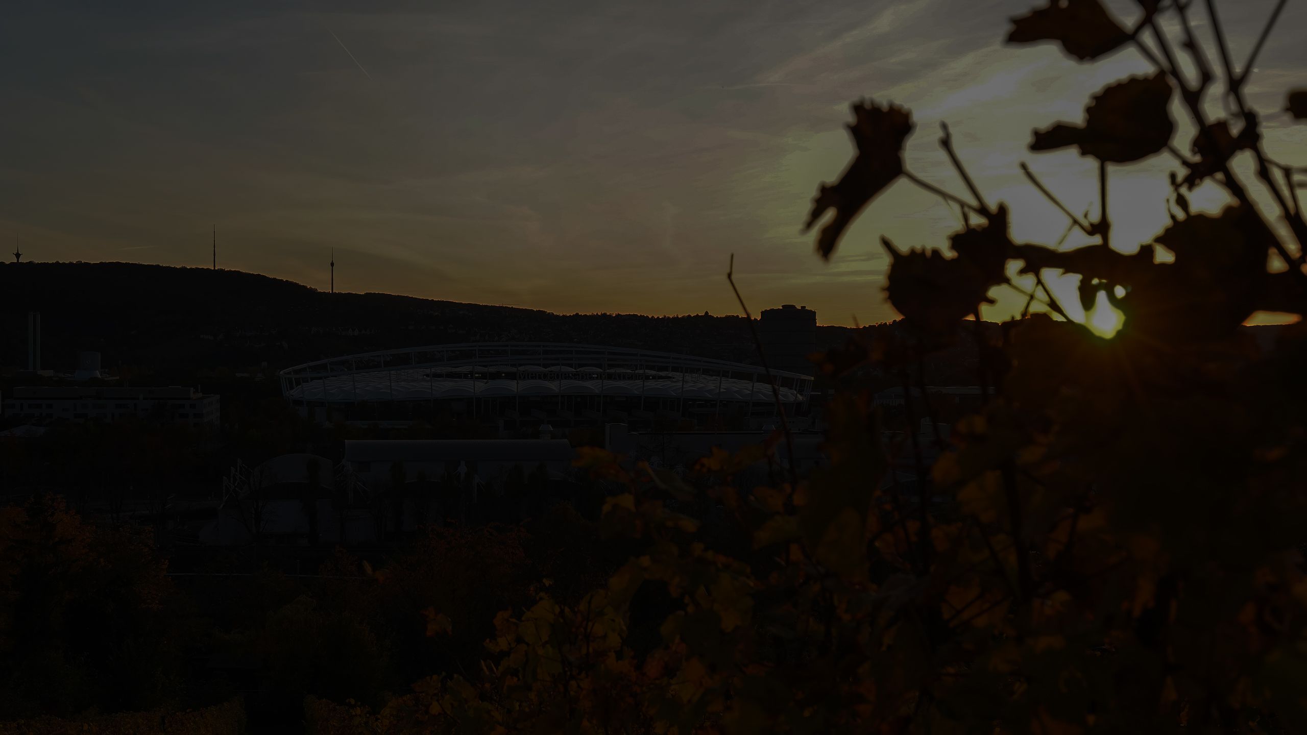 An exterior shot of the Stuttgart Arena in shadow