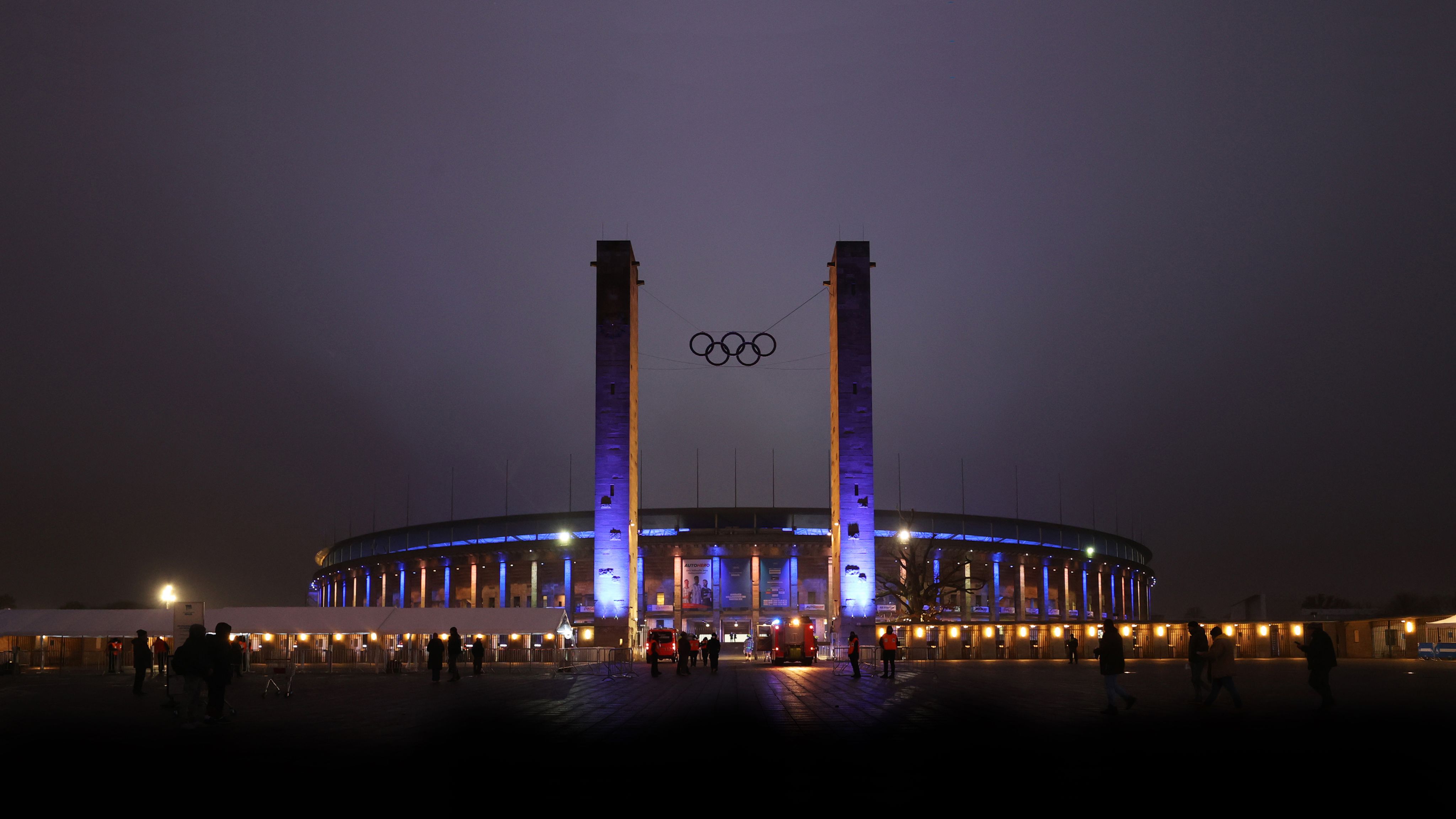 An exterior shot of Olympiastadion Berlin at night time