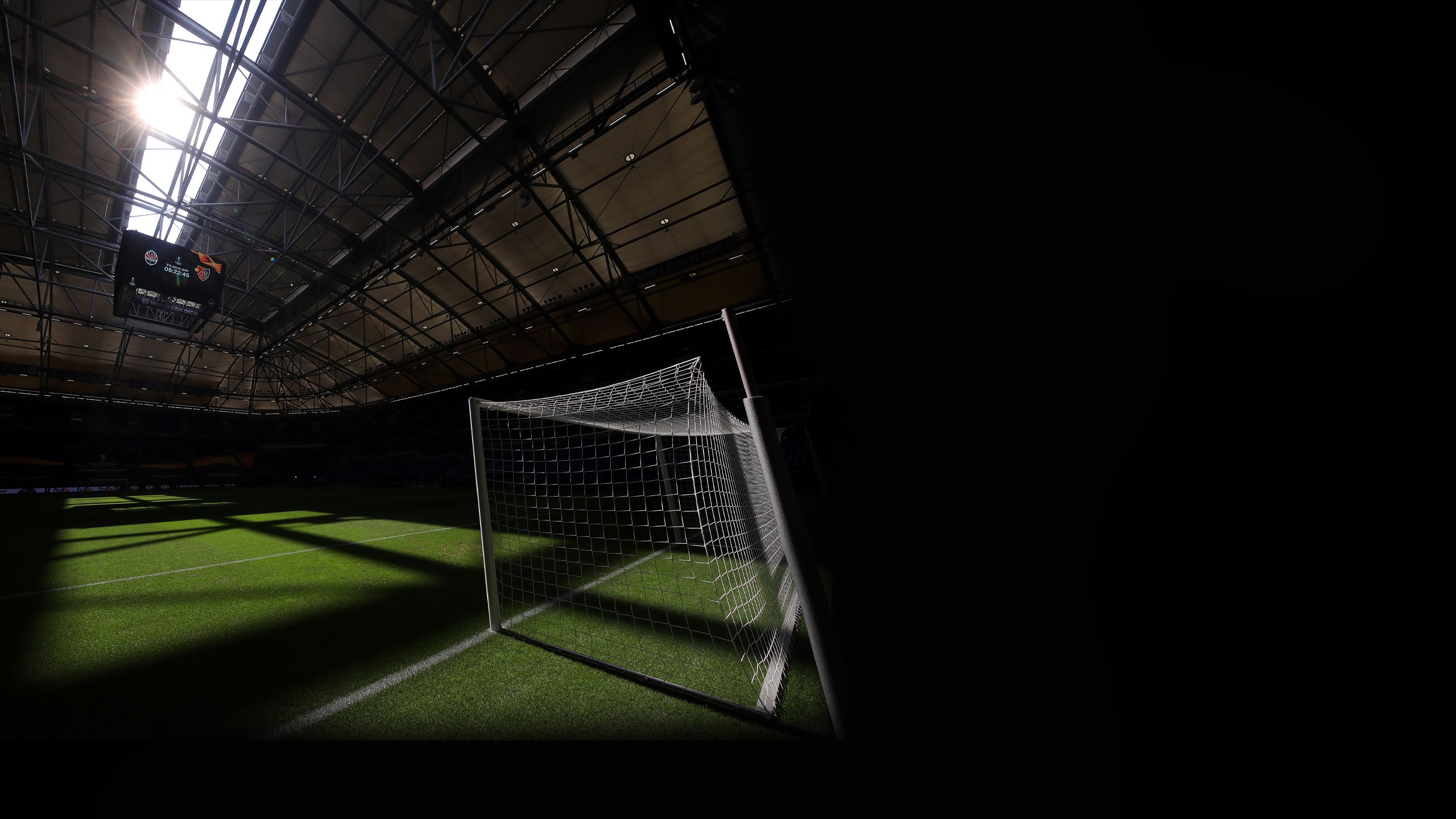 Sun shines through the partly opened roof in the Stadium at Gelsenkirchen