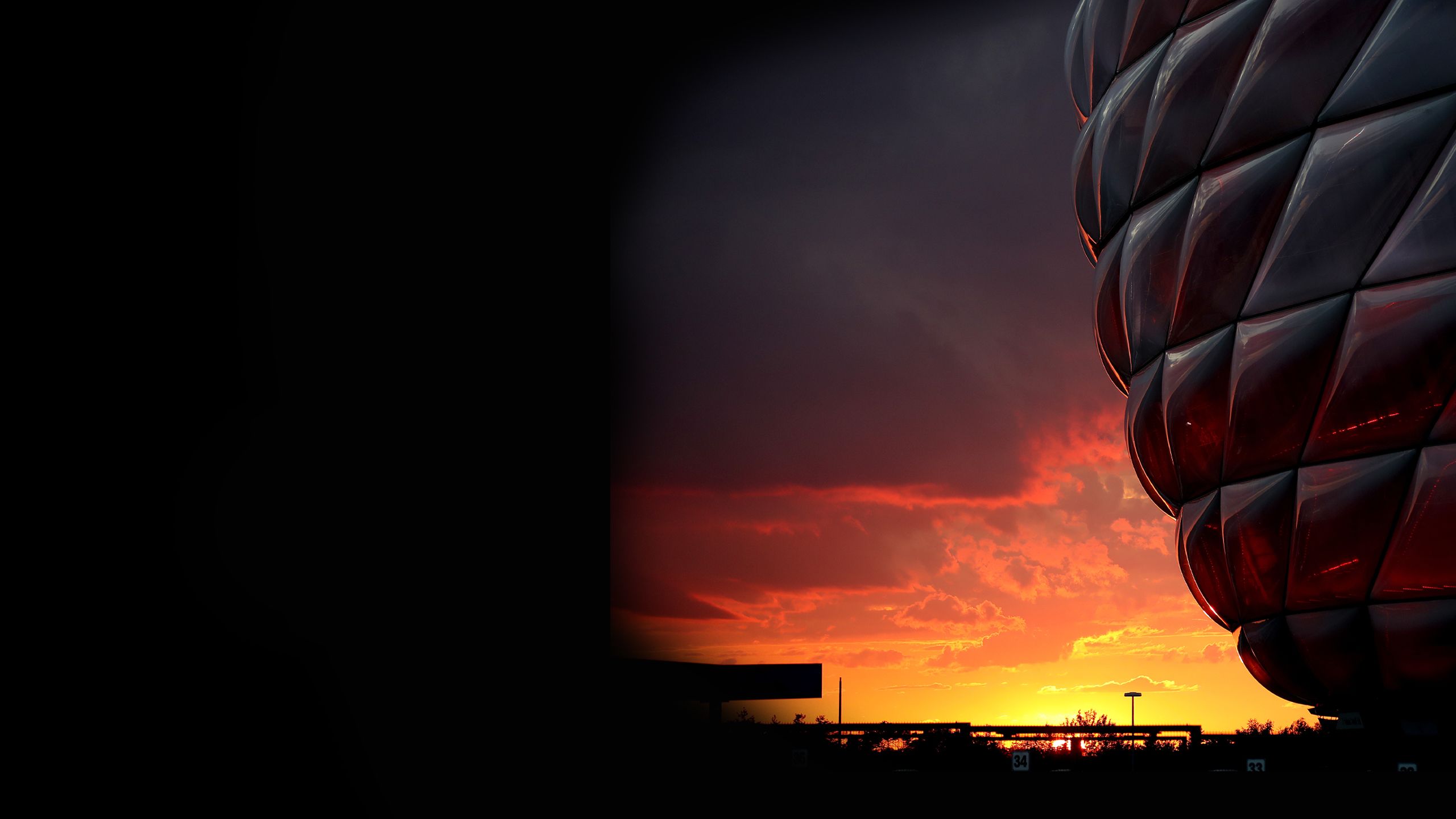 The sun sets in an exterior view of the stadium in Munich