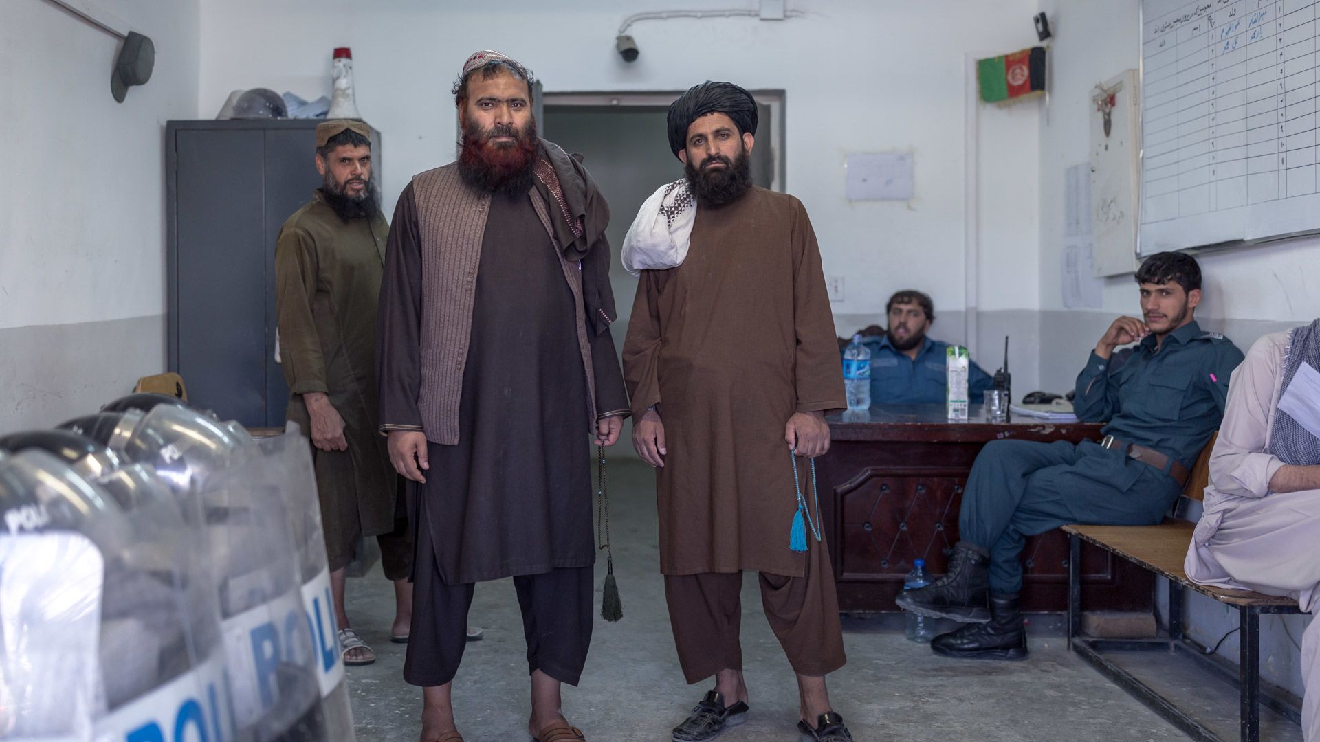 Taliban elders Mullah Sultan (L) and Mawlawi Fazel Bari (R) in the prison guard's office