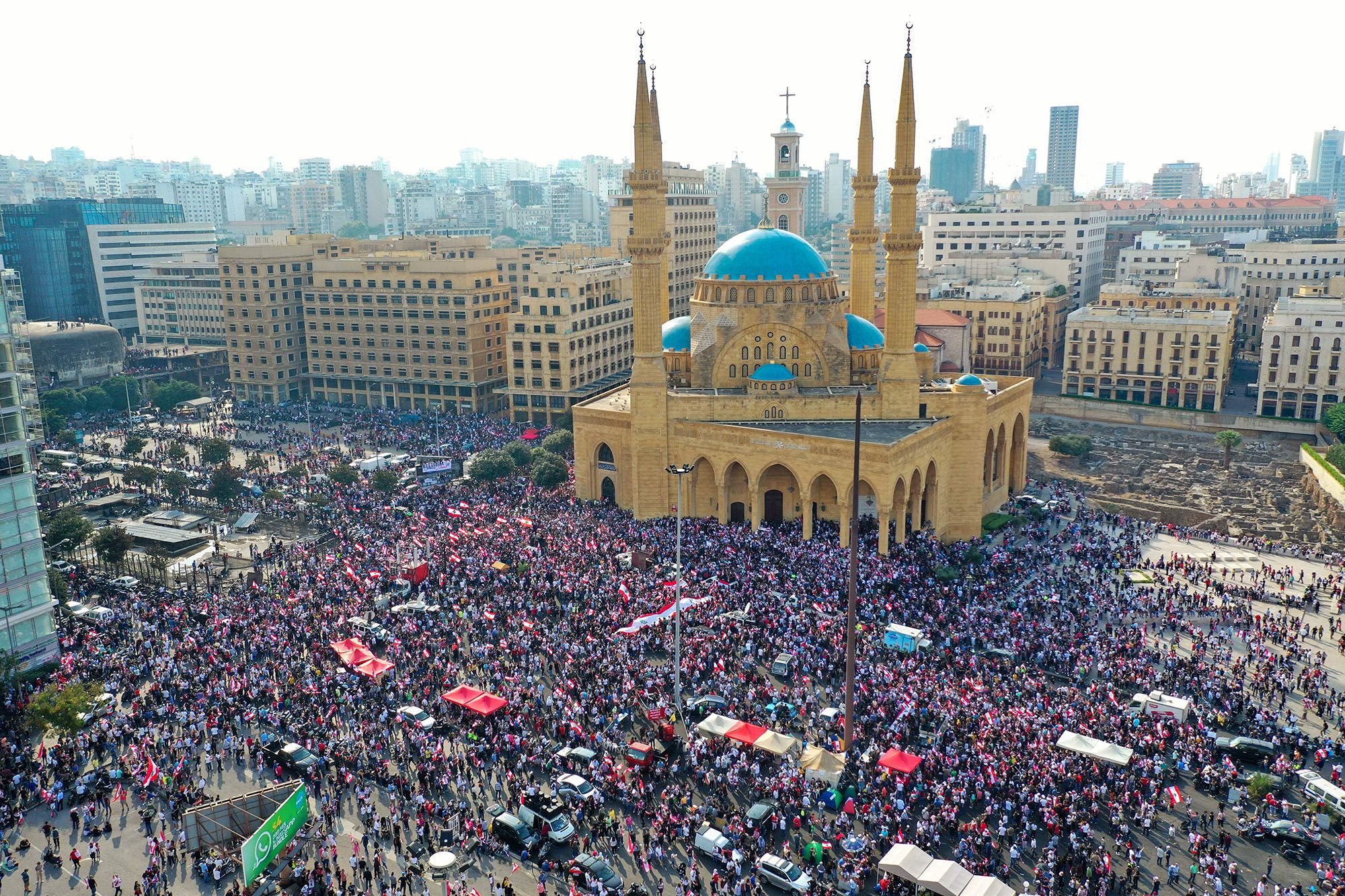 October 20, 2019,Lebanese protesters rallying outside the Mohammed al-Amin Mosque and the nearby Maronite Cathedral of St George in Beirut