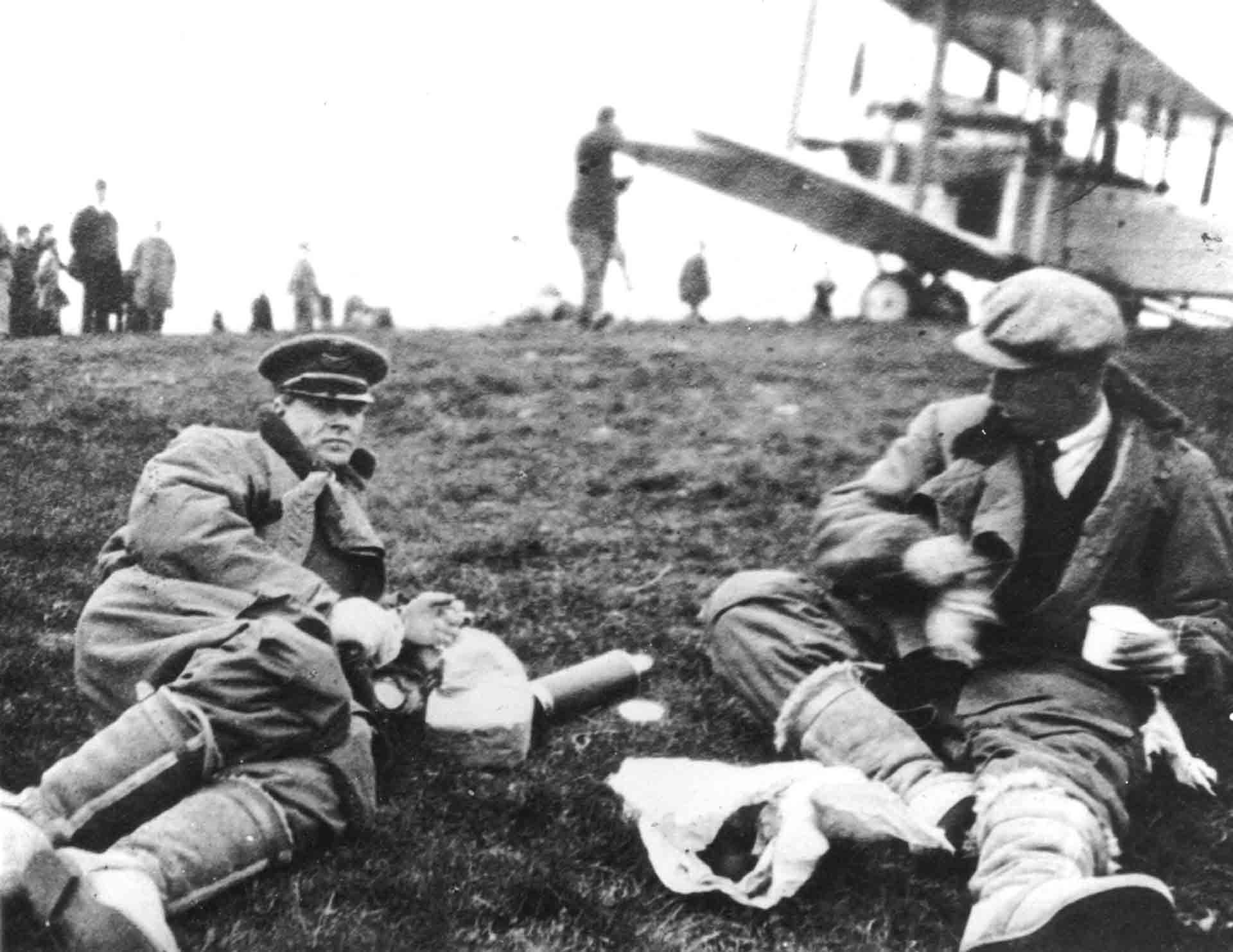 Alcock and Brown relaxing in field
