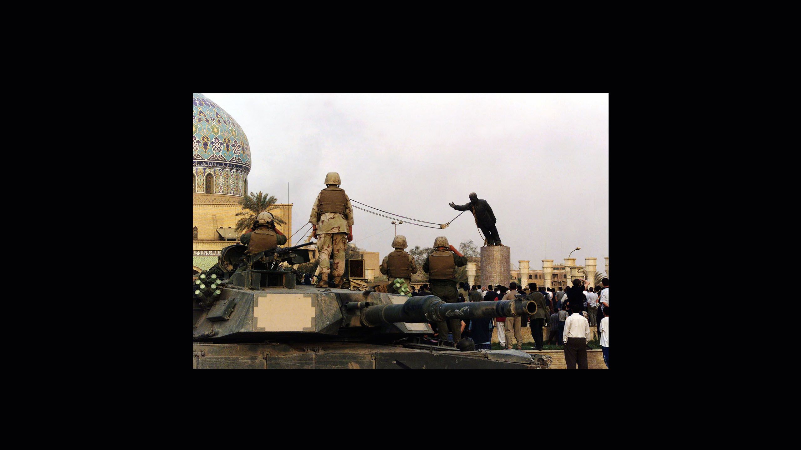 Toppling statue of Saddam Hussein in Baghdad, Iraq, 2003