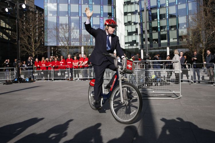Boris Johnson rides a bicycle during the announcement of Santander as the new sponsor of Santander Cycles on 27, 2015 in London, England