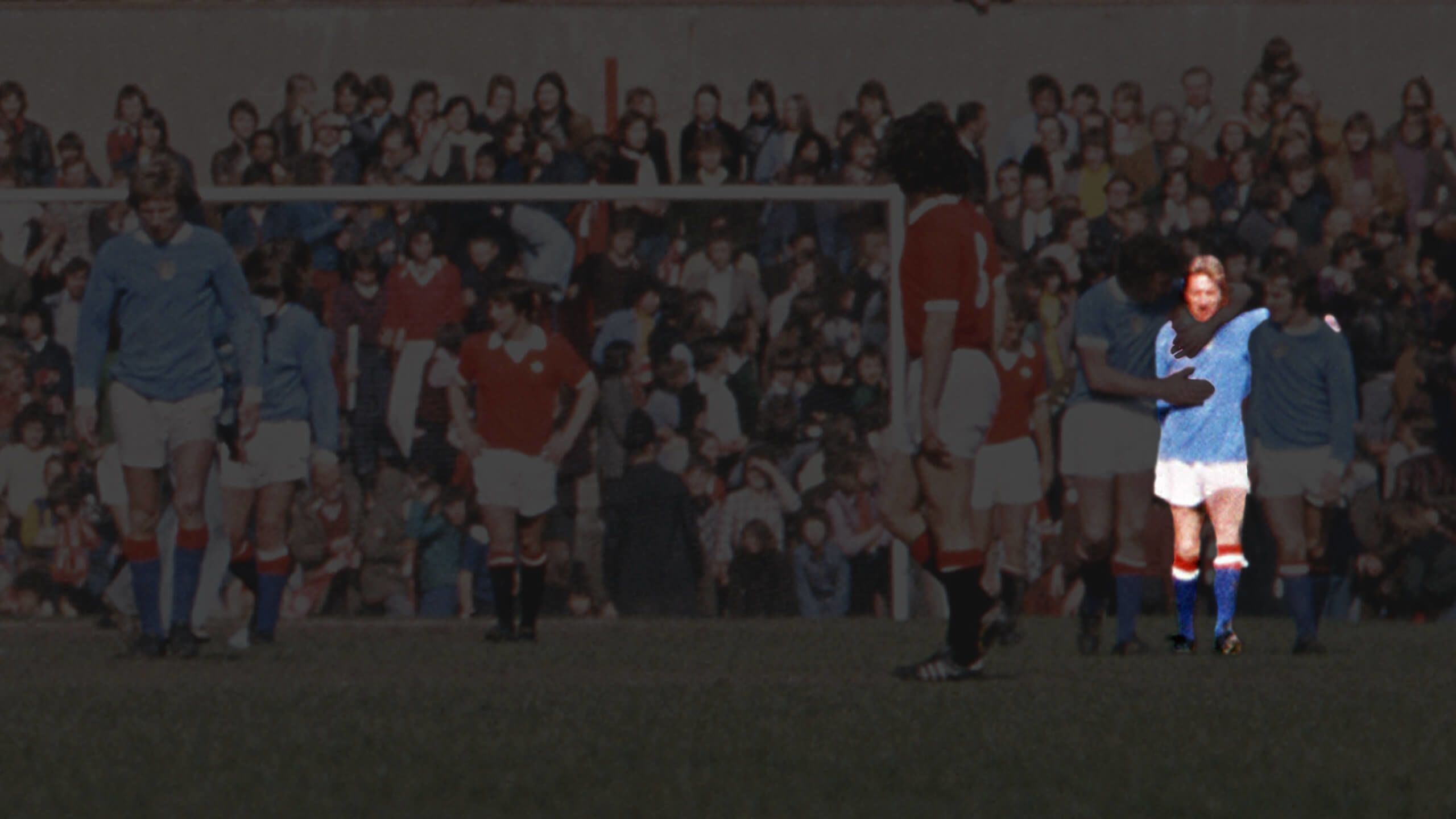 Denis Law (middle of three on right) reacts after scoring for Manchester City against Manchester United in 1974