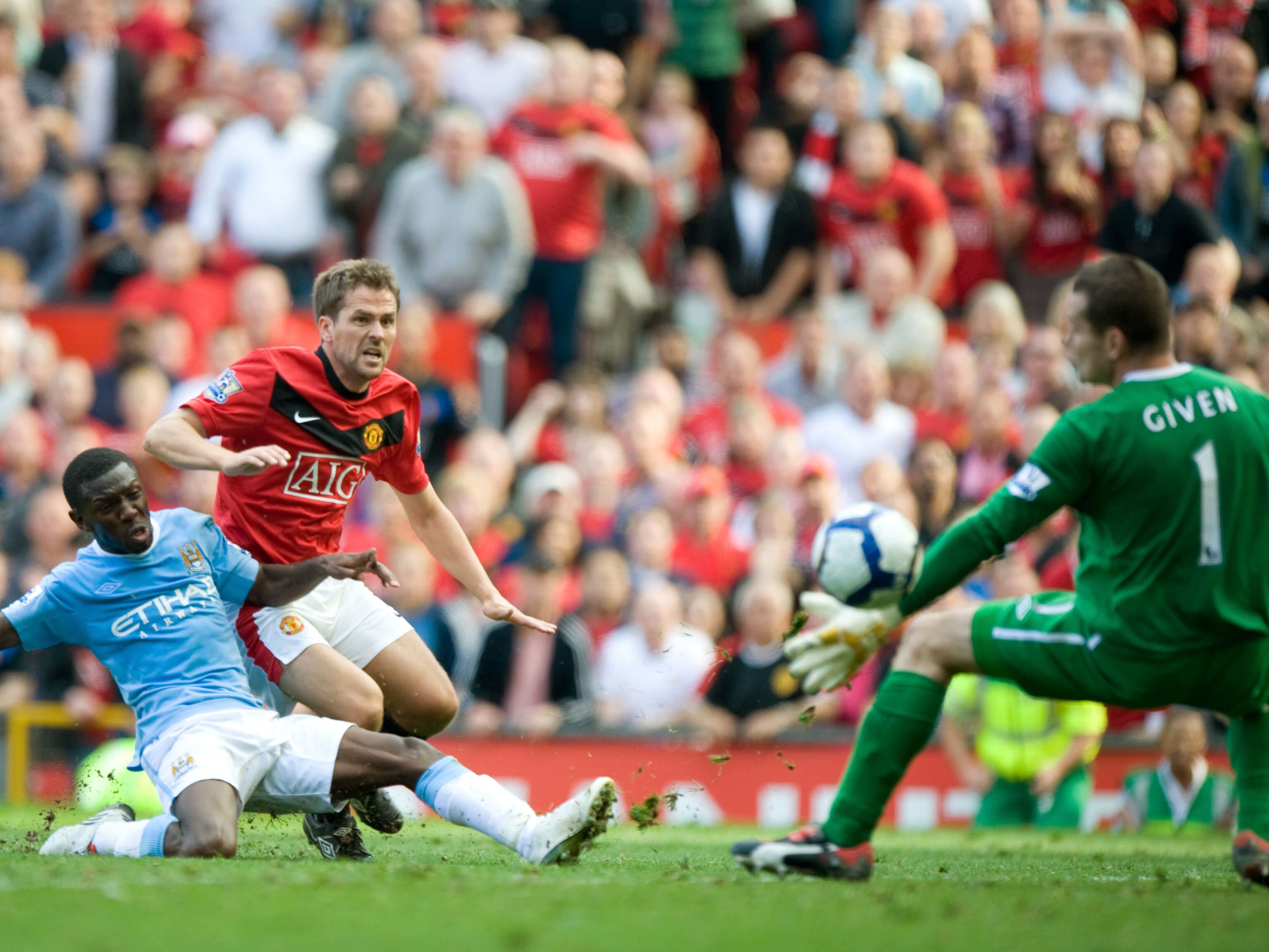 Michael Owen of Manchester United scores the winning goal to make it 4-3 in the derby in 2009