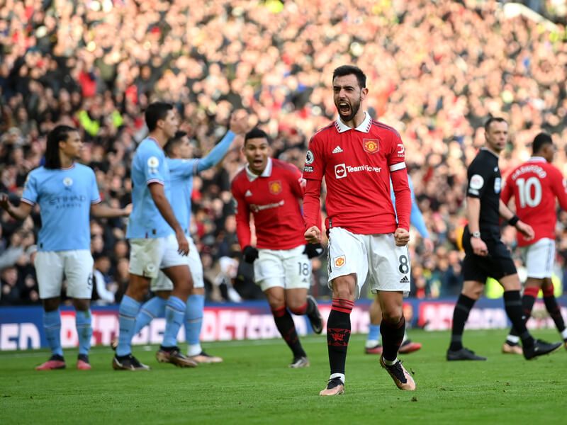 Bruno Fernandes celebrates scoring against City in the derby in January 2023