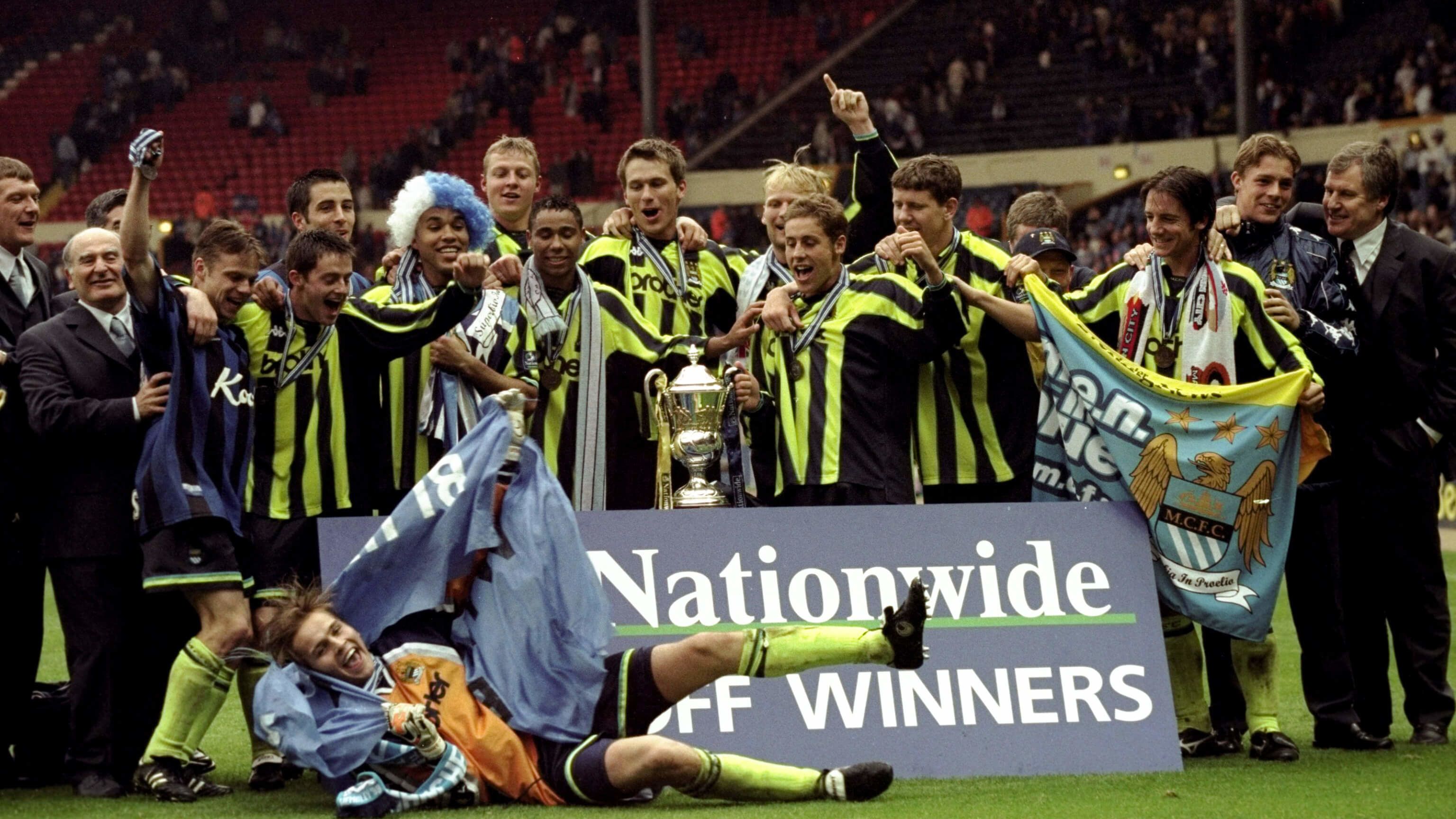 Manchester City players celebrate their penalty shootout victory in the 1999 Division Two play-off final