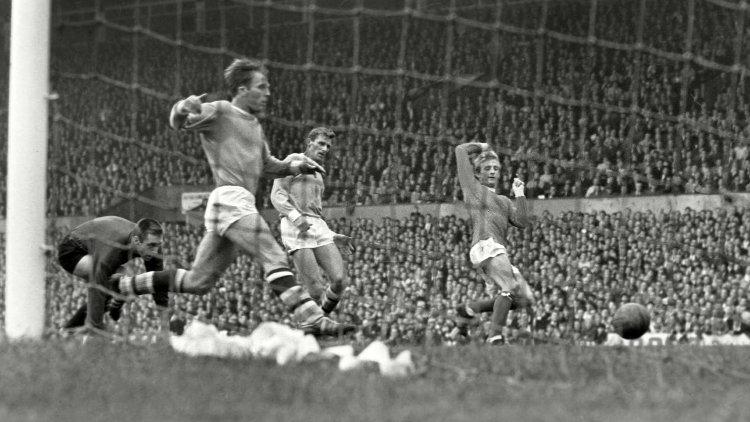 United's Denis Law scores the winning goal at Old Trafford past City's Tony Book Alan Oakes and goalkeeper Harry Dowd in Man Utd 1-0 Man City on 17th Sep 1966
