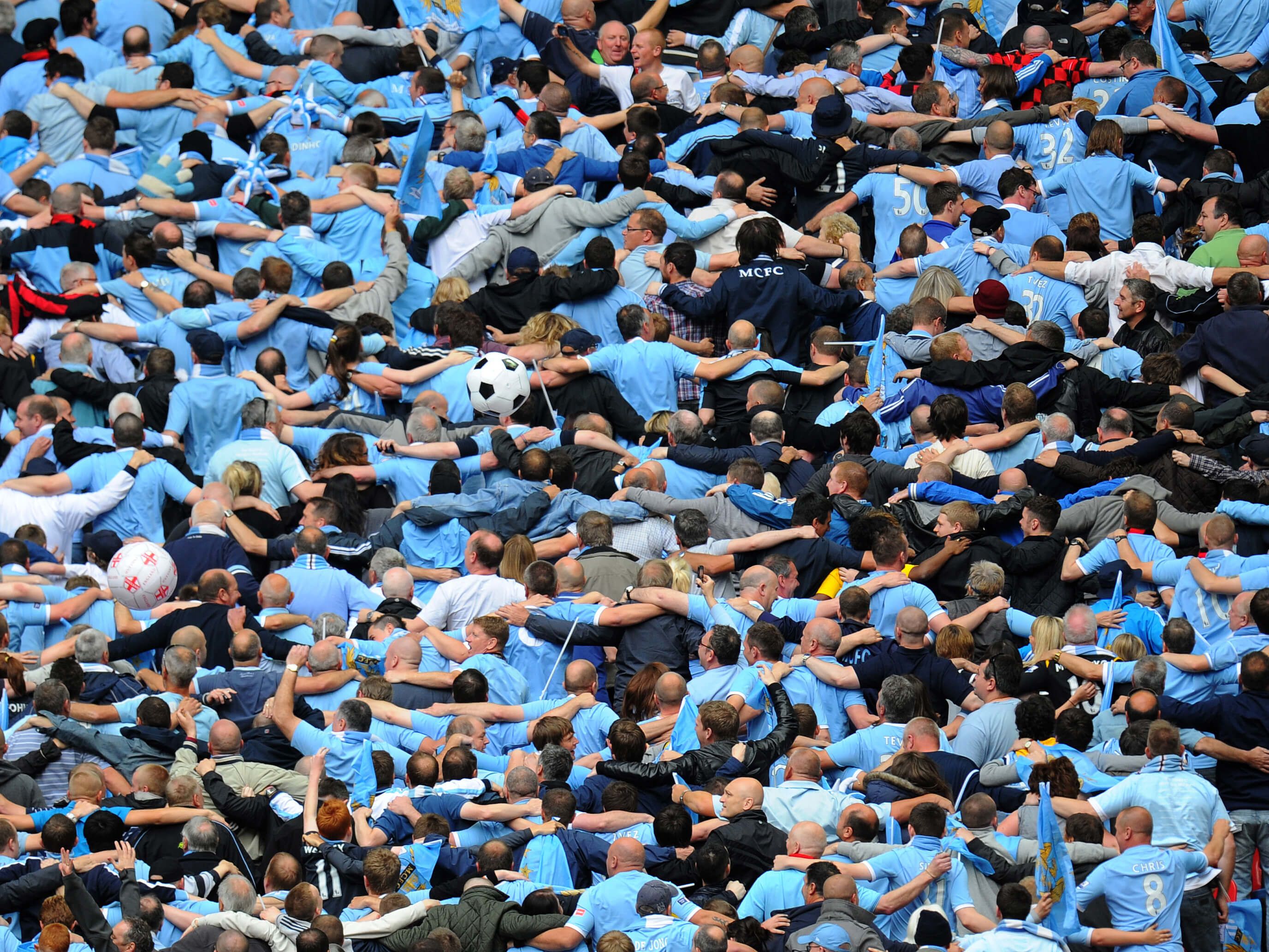 Manchester City fans doing their 'Poznan' celebration