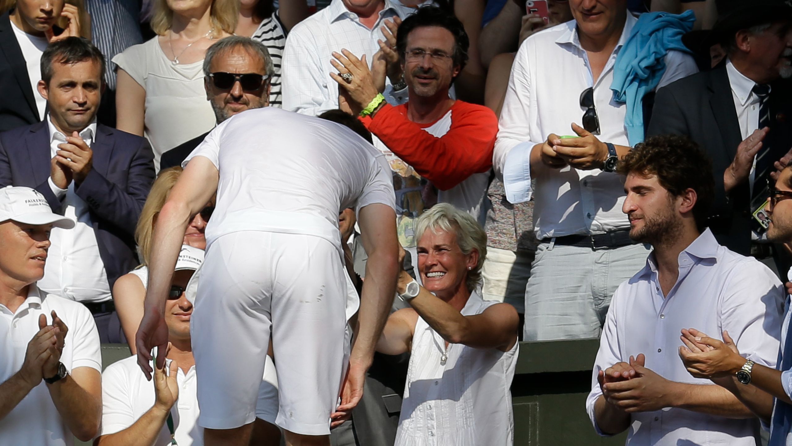 Andy Murray is greeted by his mother Judy as he climbs up the Centre Court stands