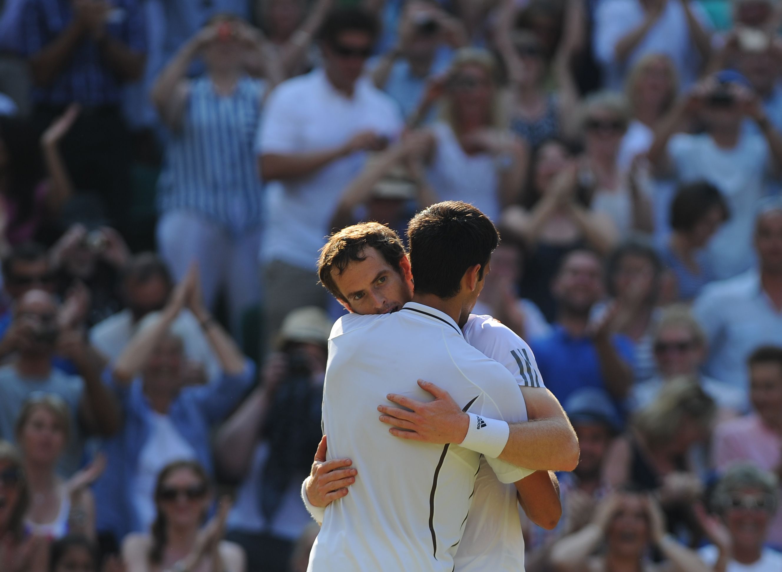 Andy Murray and Novak Djokovic hug after the match