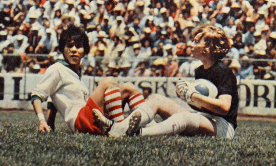 England goalkeeper Lillian Harris with a Mexican player