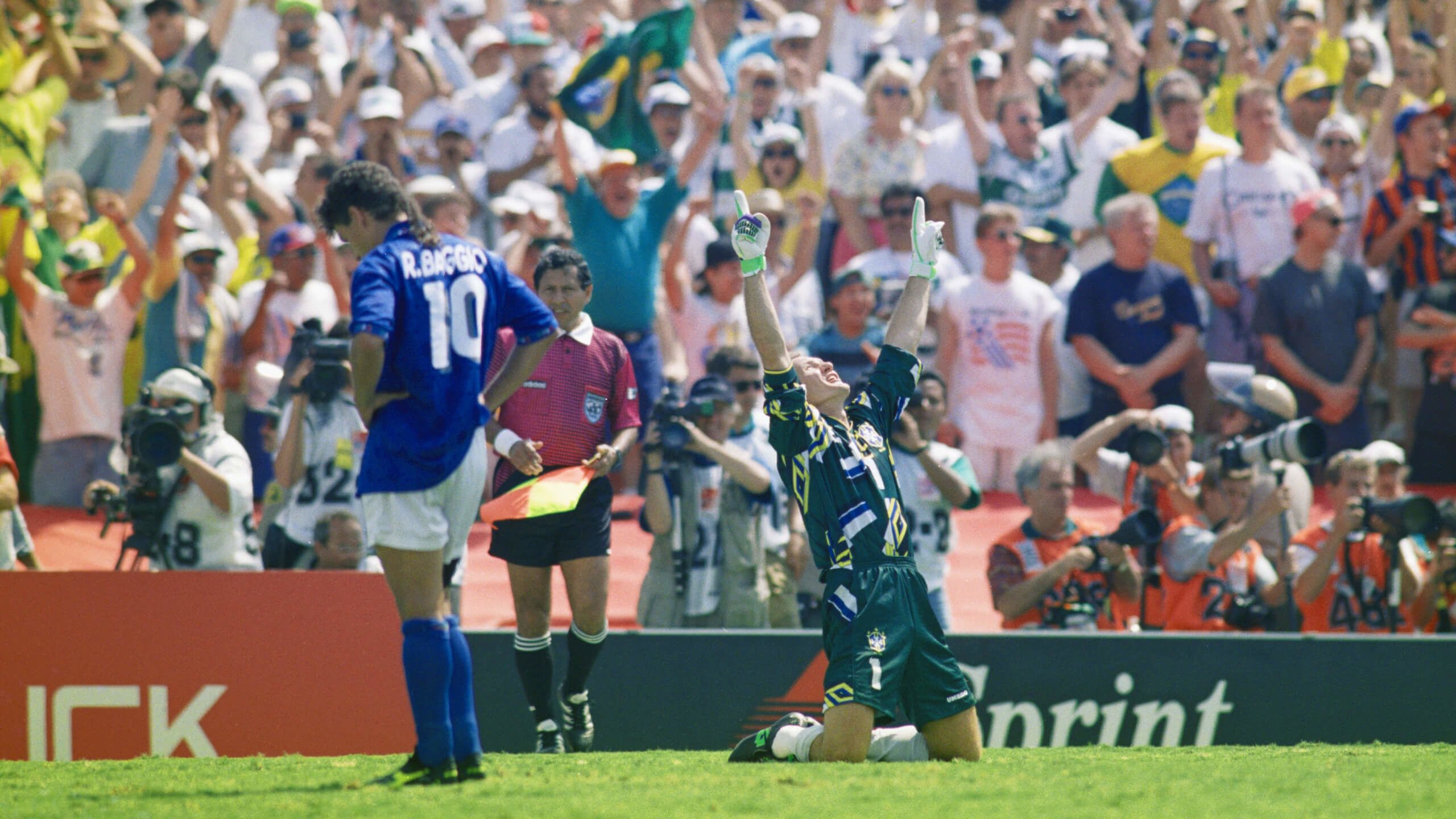 Claudio Taffarel (right) celebrates after Roberto Baggio (left) misses the decisive penalty in the 1994 World Cup final