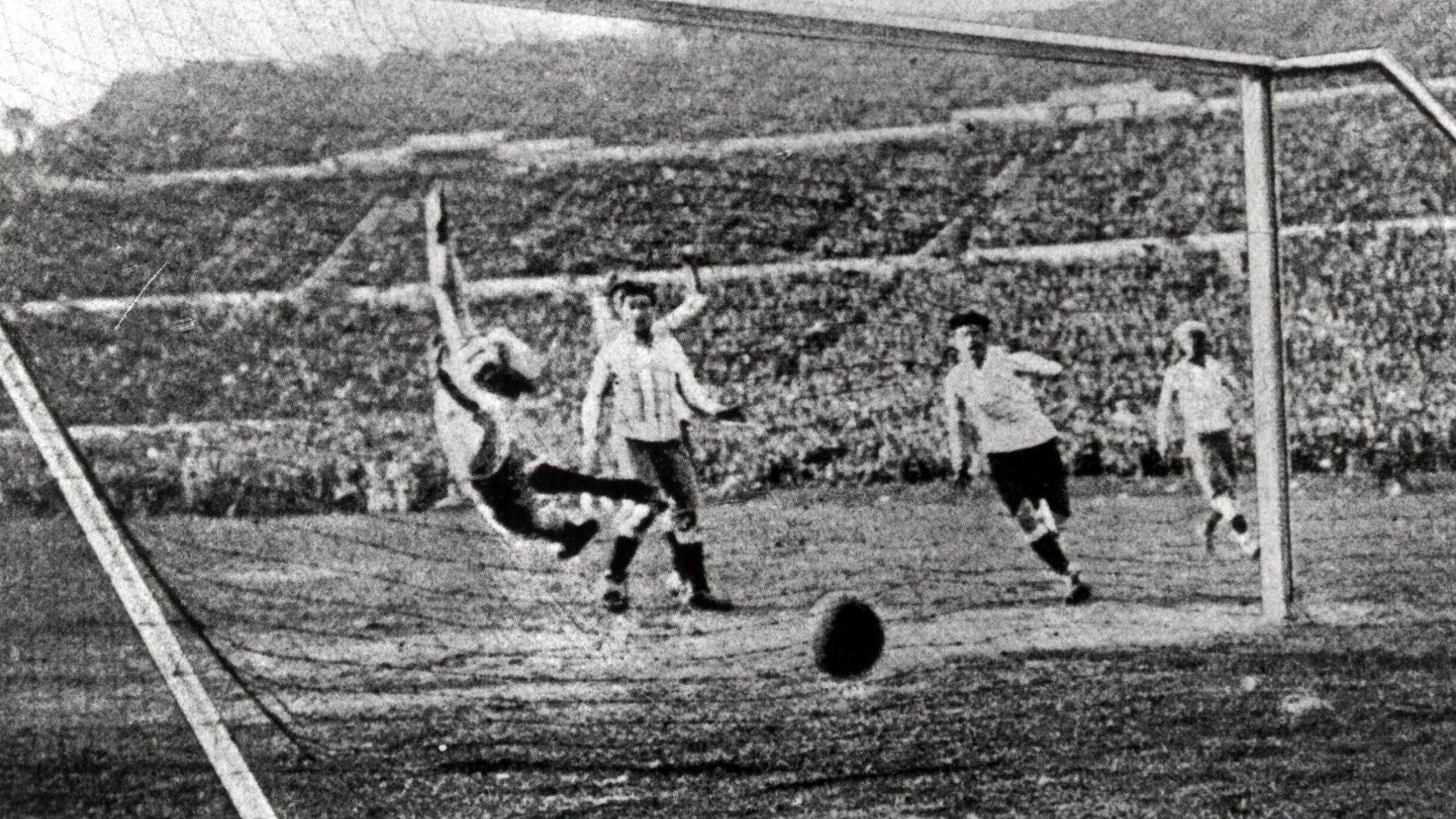 Argentine goalkeeper Juan Botasso dives in vain in an attempt to stop Uruguay's fourth goal of the Final, scored by Hector Castro