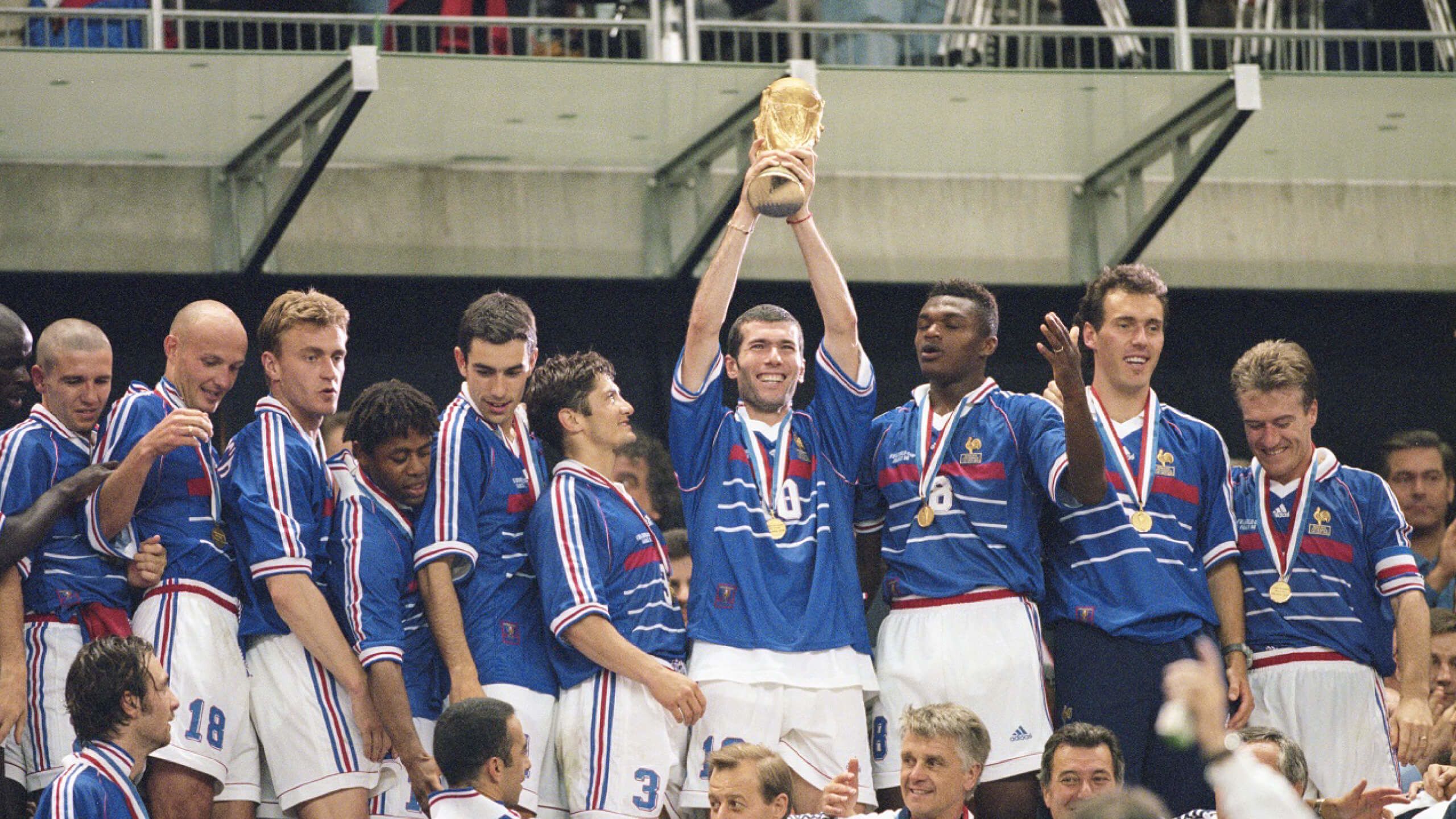 Zinedine Zidane holds the World Cup trophy in 1998
