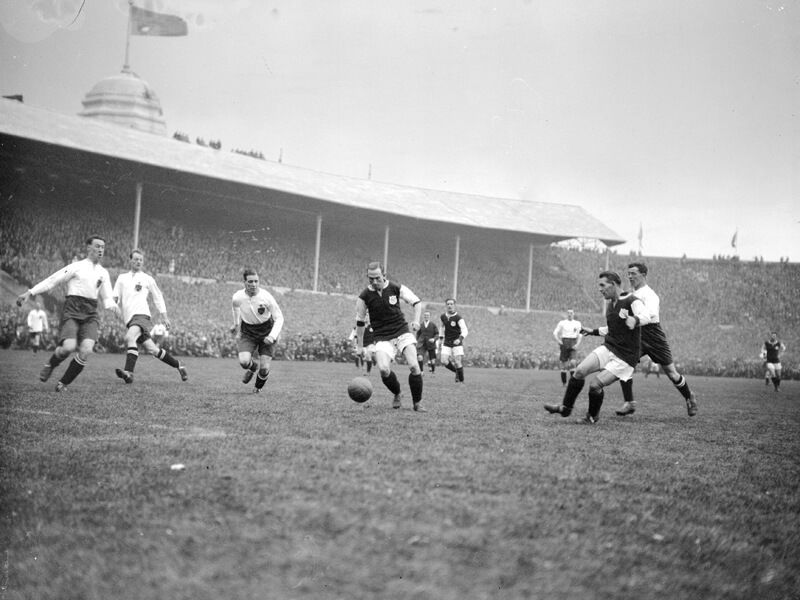 West Ham United's Billy Moore receives a pass from team-mate Jimmy Ruffell in the 1923 FA Cup final
