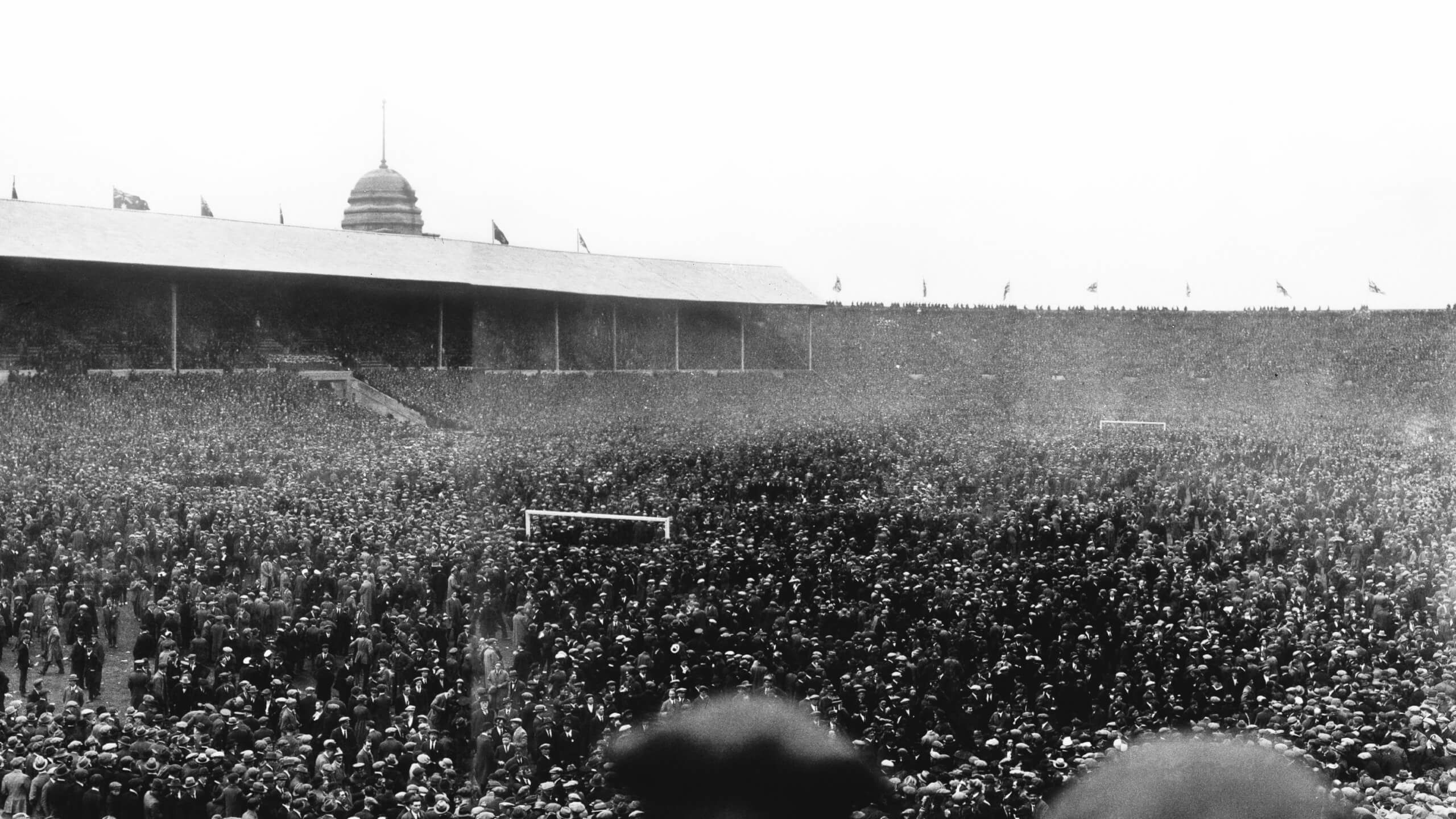 Thousands of fans on the pitch at the stadium at Wembley ahead of the 1923 FA Cup final