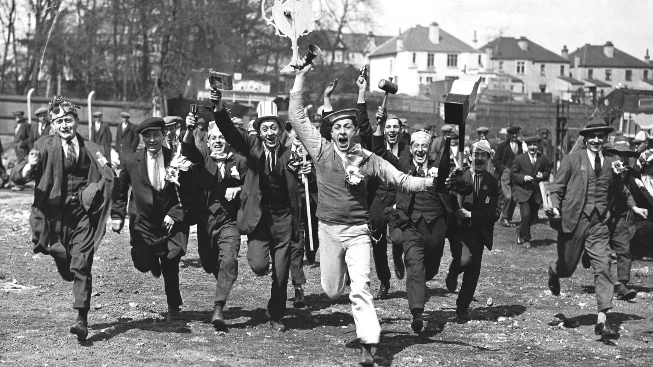 Supporters charge towards the individual taking the photo in excitement at attending the 1923 FA Cup final