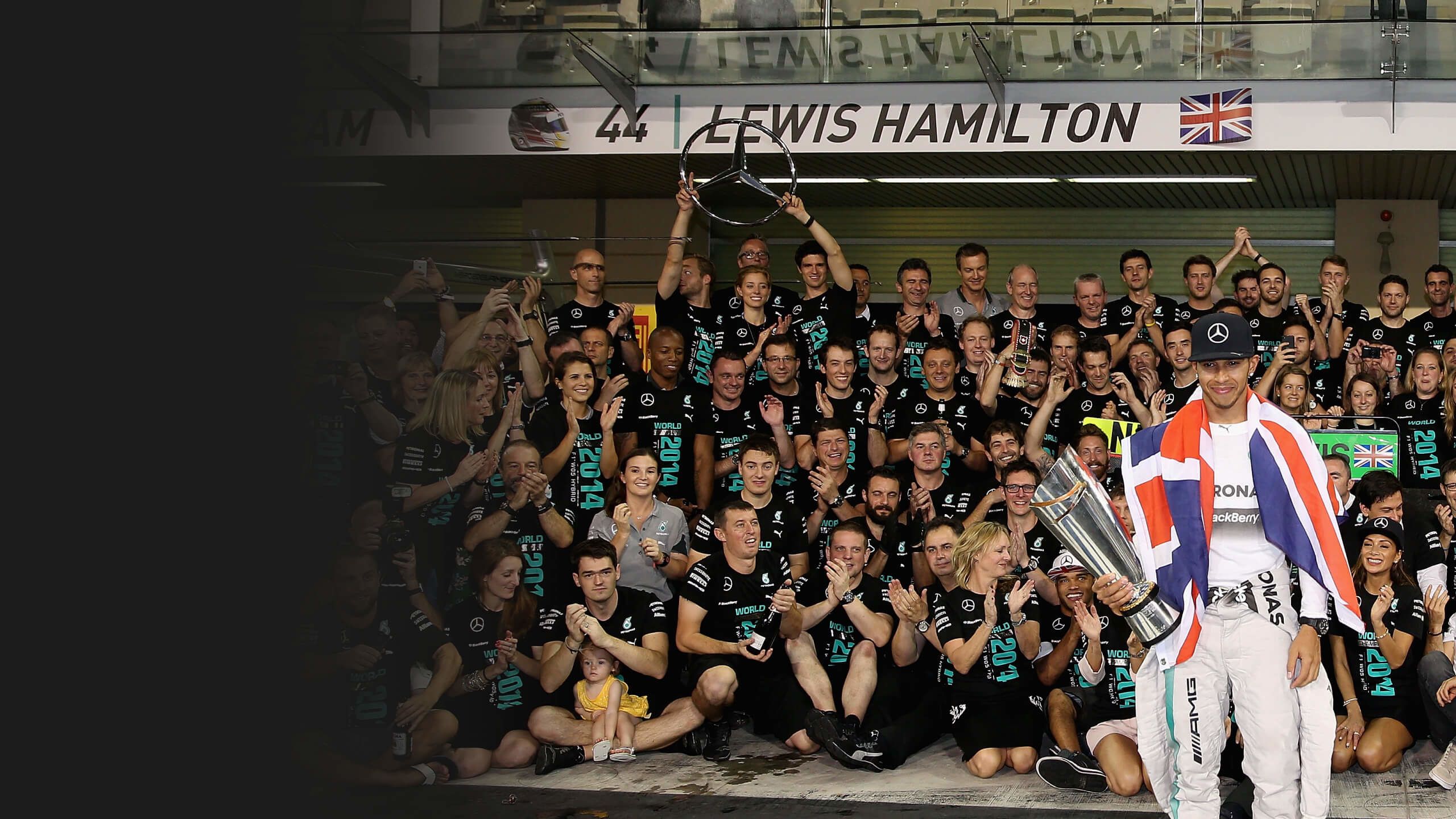 Lewis Hamilton celebrates the 2014 title with the Mercedes team