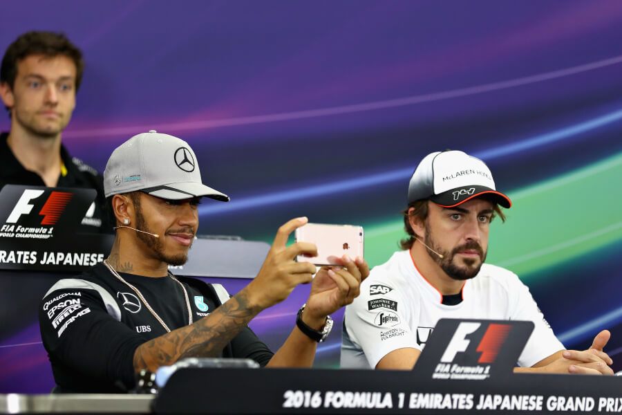 Lewis Hamilton takes a selfie during a press conference in Japan in 2016