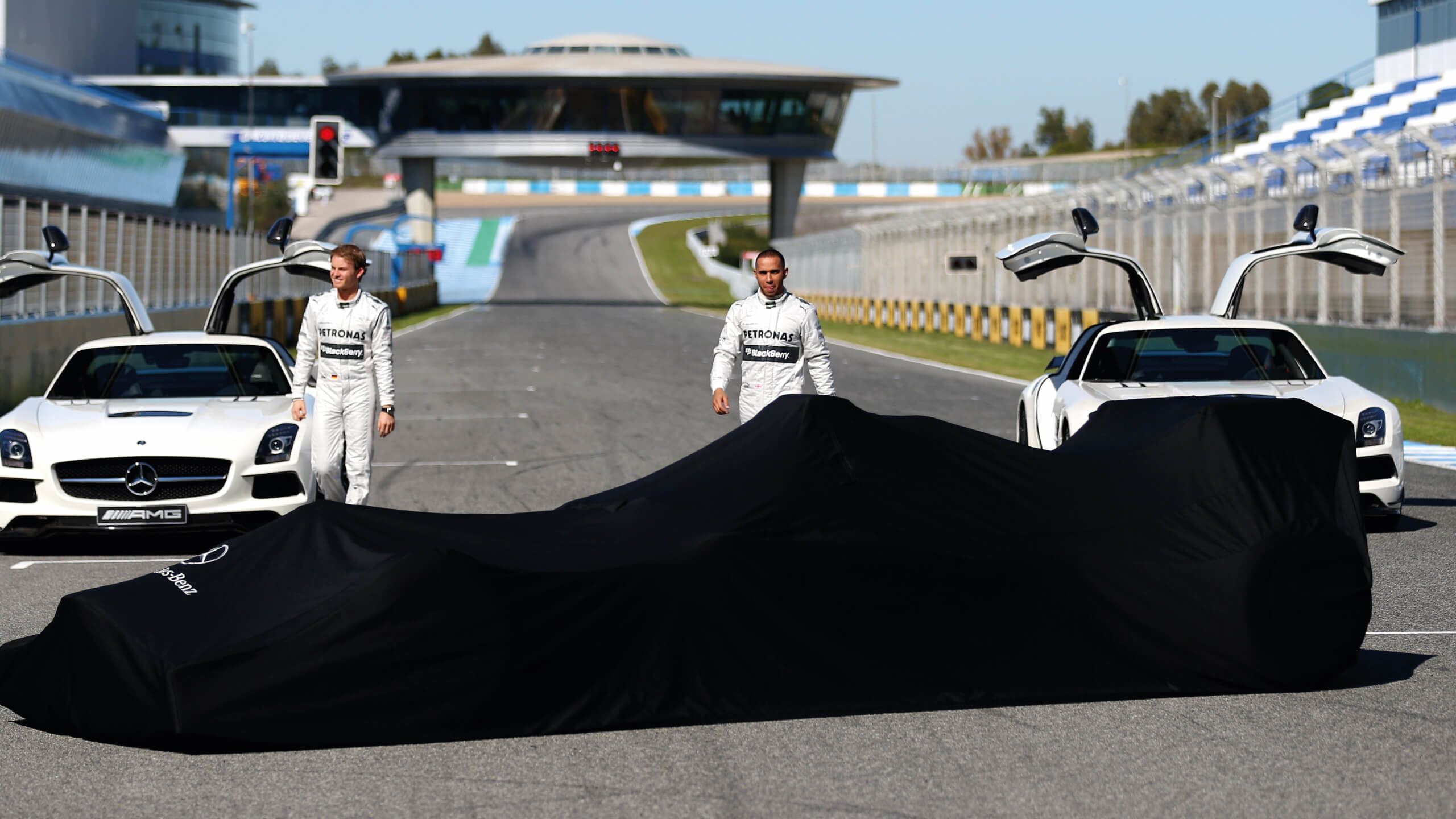 Lewis Hamilton and Nico Rosberg unveil the Mercedes car in 2013