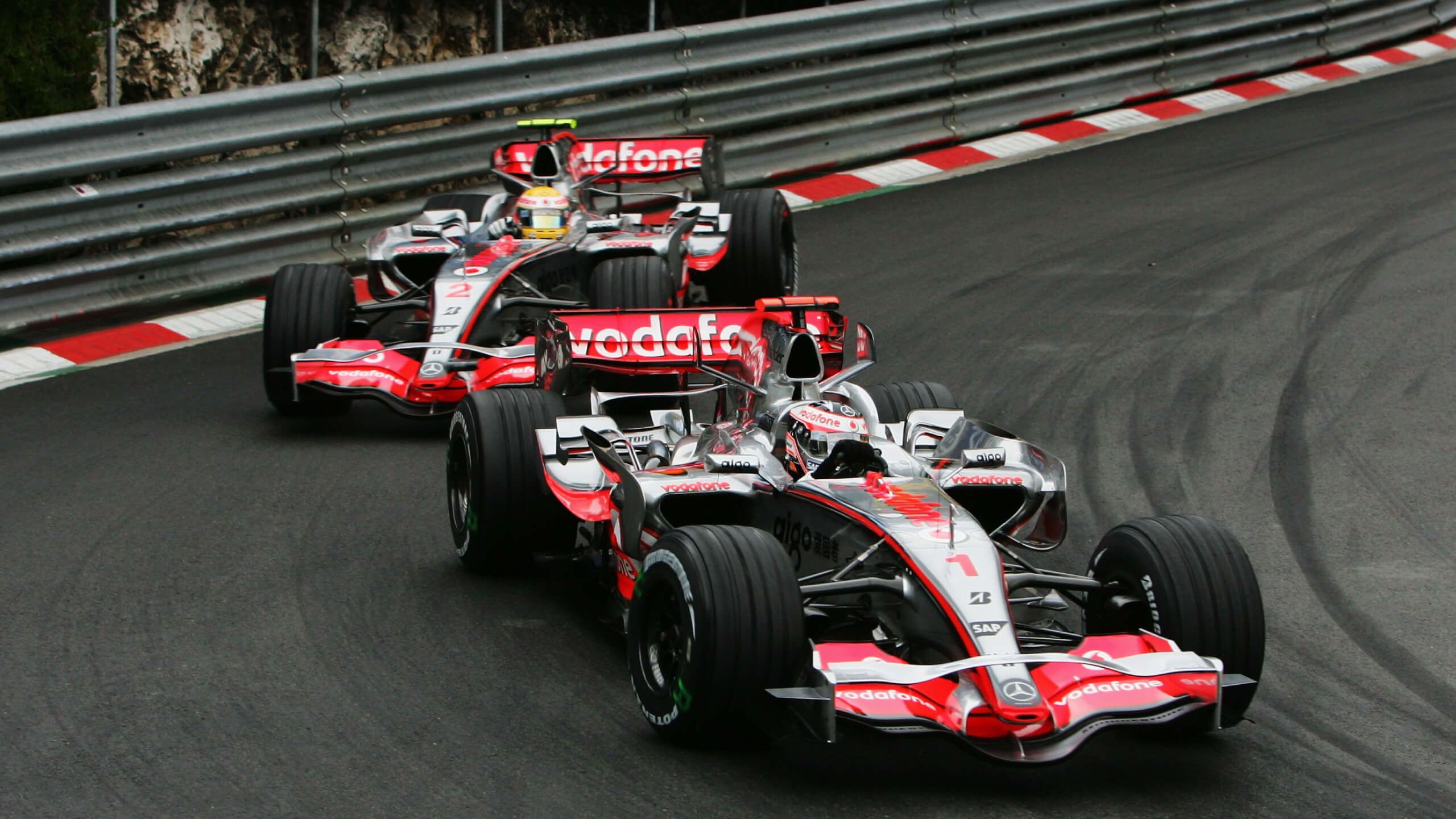 Lewis Hamilton and Fernando Alonso compete during a race
