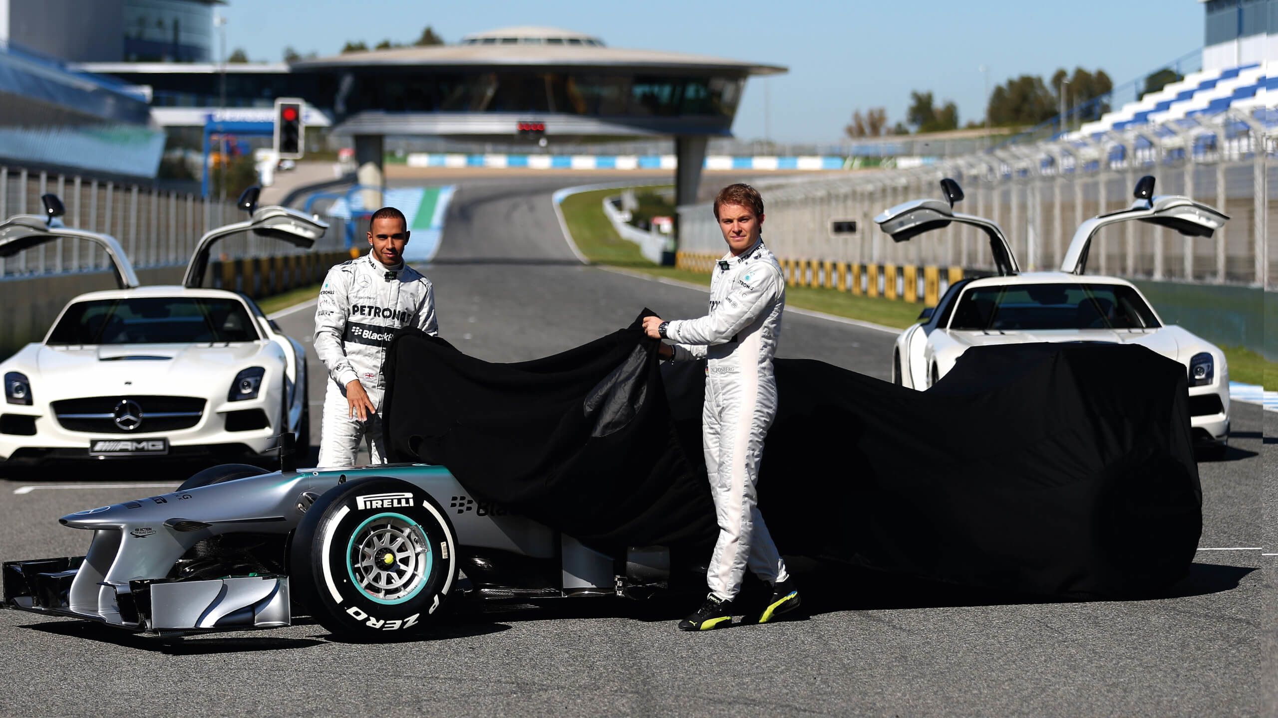 Lewis Hamilton and Nico Rosberg unveil the Mercedes car in 2013